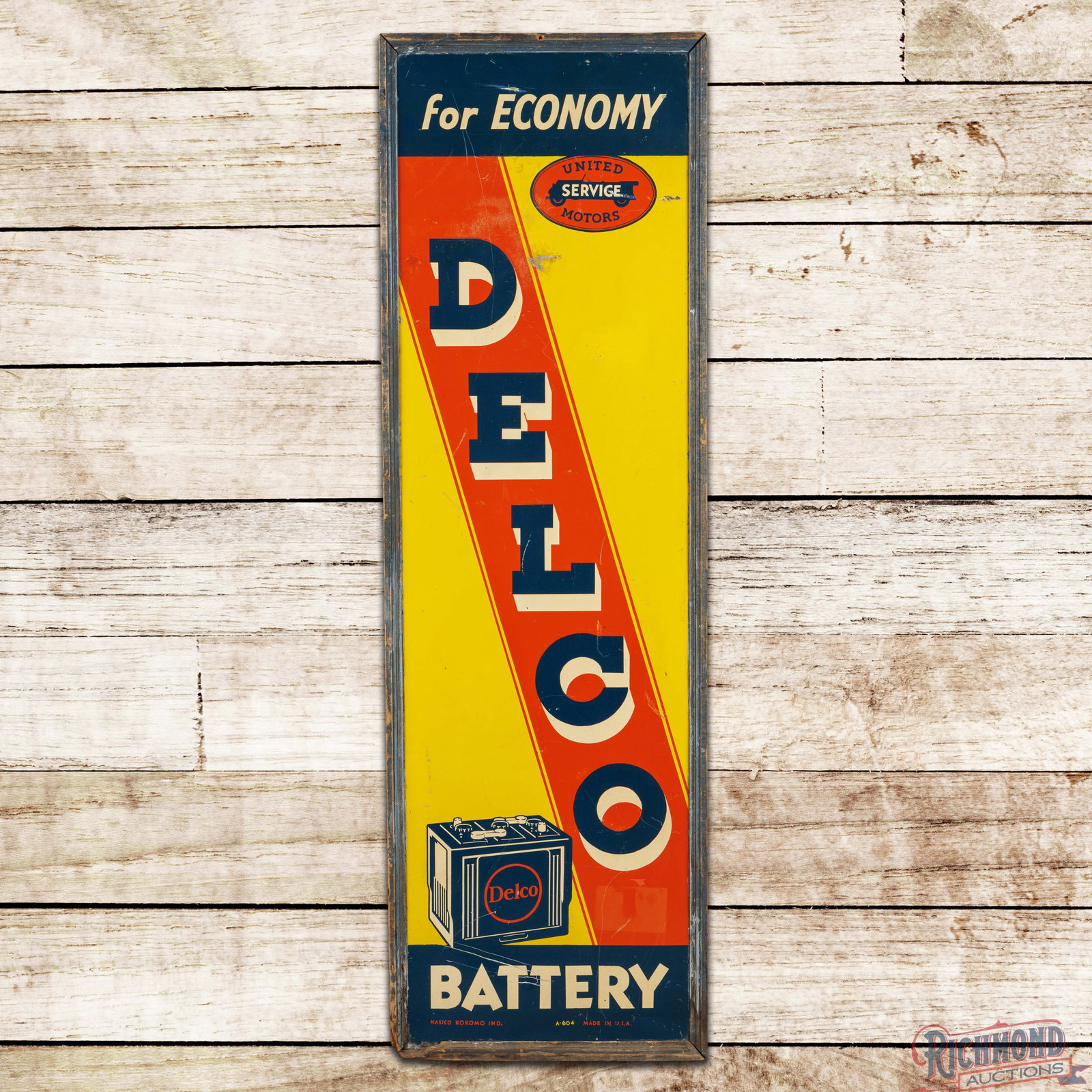 Delco Battery for Economy 5' Single Sided Tin Wood Framed Sign w/ United Motors Service Logo: Scarce SST (single sided tin) sign with the factory wooden frame has very good color and shine. The field exhibits general wear with dings, fine scratches and discoloration in the upper field. The out