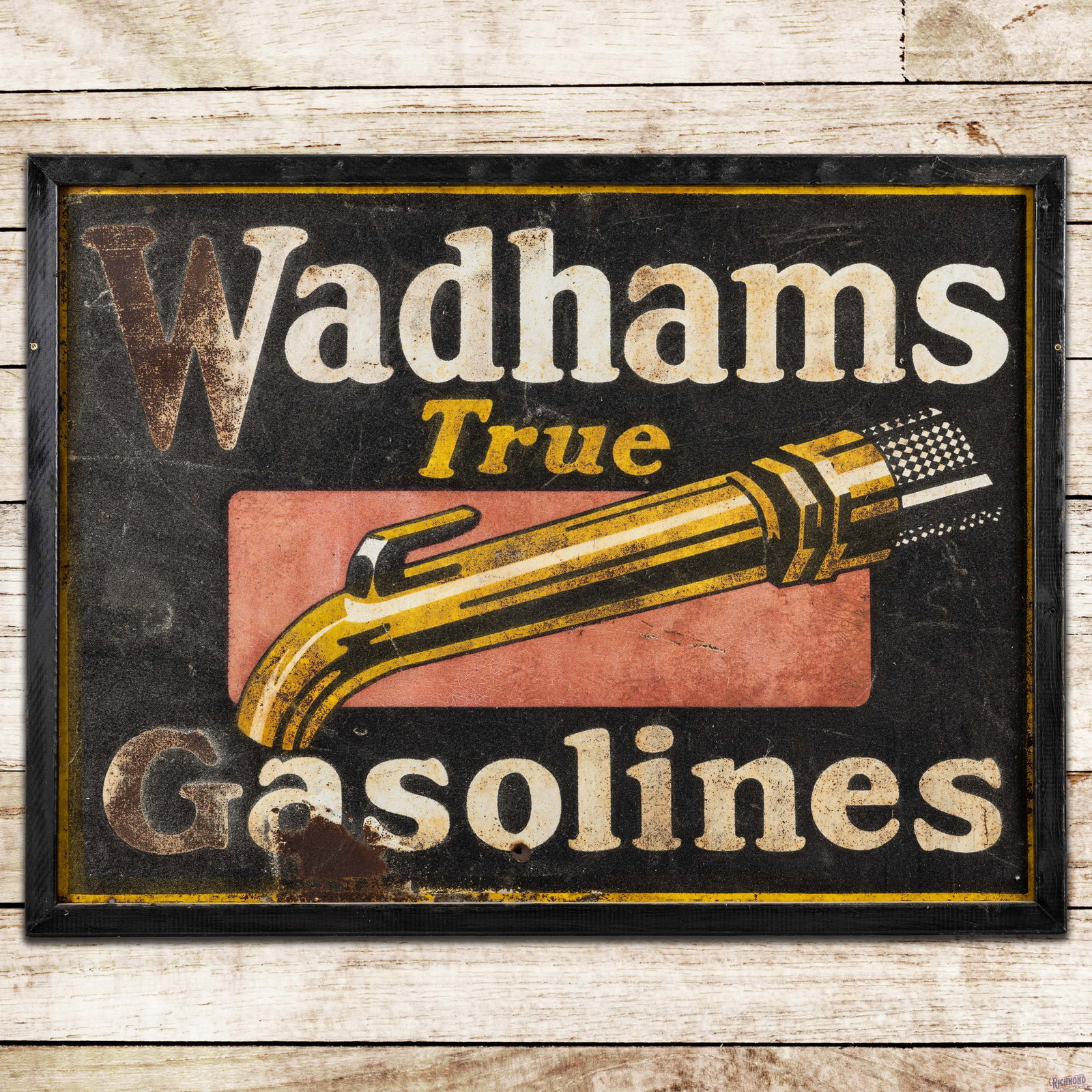 Early Wadhams True Gasolines Single Sided Tin Smaltz Sign w/ Nozzle: SST (single sided tin) smaltz painted sign with an added wooden frame has good color. The sign exhibits general age related wear throughout with fine scratches, paint chips and oxidation. The lower ou