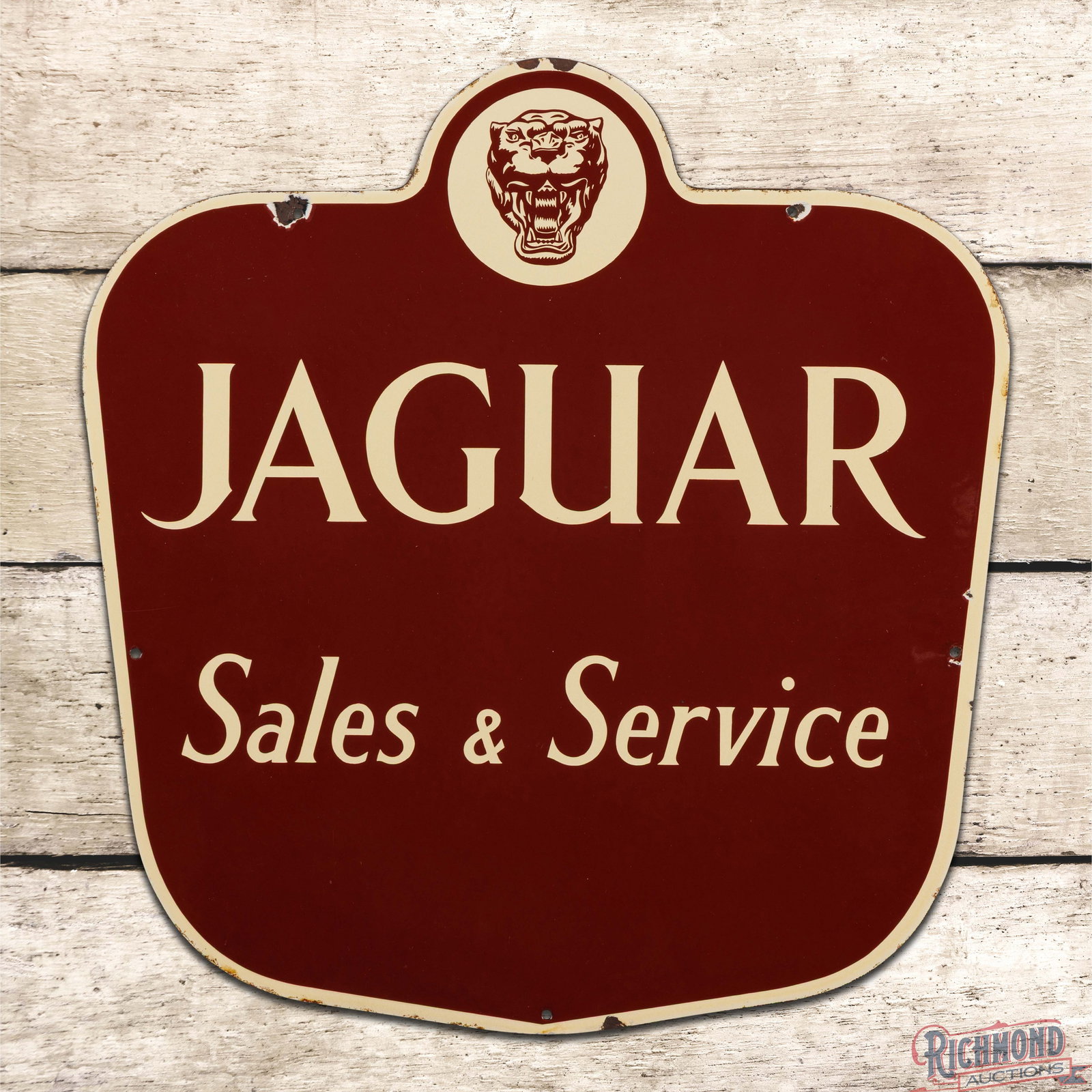 Jaguar Sales & Service Die Cut 20" Single Sided Porcelain Sign w/ Logo "Small": SSP (single sided porcelain) die cut sign has excellent color and gloss. The field is clean. The perimeter has small chips with minor discoloration along the edges. Overall a fantastic example in an e