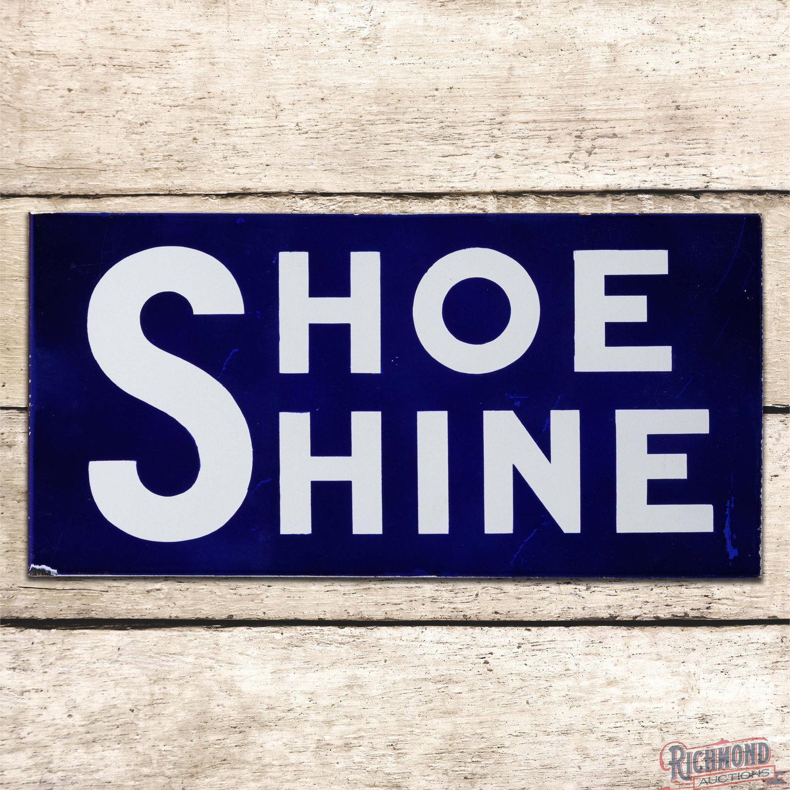 Shoe Shine 24" Double Sided Porcelain Flange Sign: DSP (double sided porcelain) flange has excellent color and gloss. The display field has minor surface imperfections with a handful or factory blemishes in the blue porcelain enamel and chips on the l