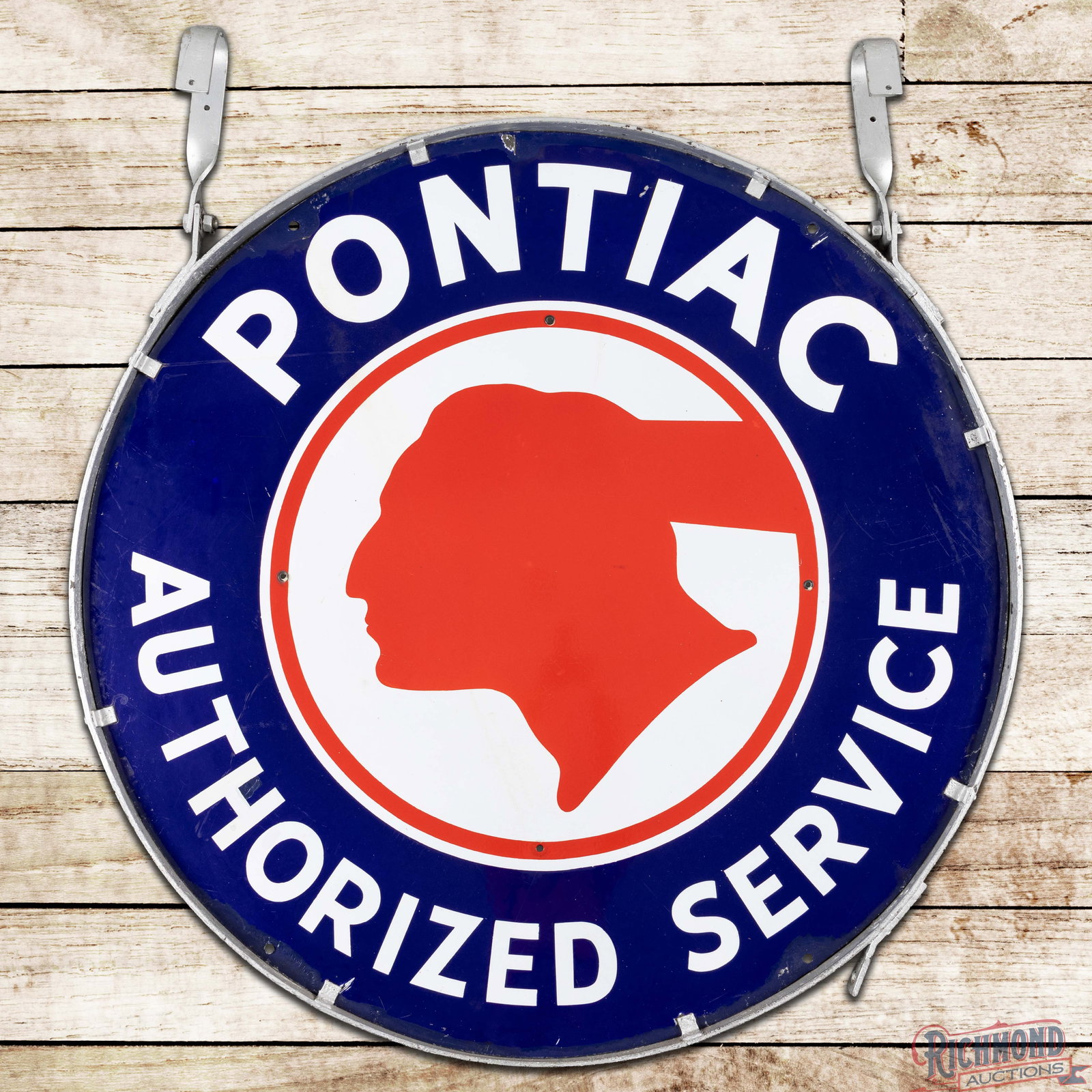 Pontiac Authorized Service 42" Single Sided Porcelain Sign w/ Ring: SSP (single sided porcelain) sign with the factory ring with hangers has excellent color and gloss. The field exhibits light surface wear with a minor area of crazing on the upper edge of the logo. Th