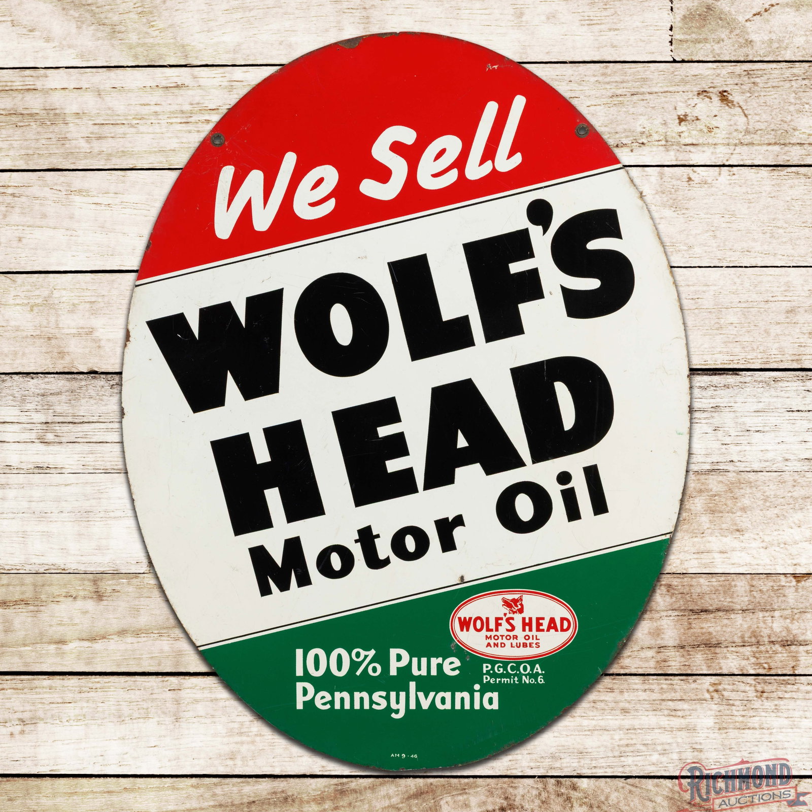 1946 We Sell Wolf's Head Motor Oil 100% Pure Pennsylvania Double Sided Tin Sign w/ Logo: DST (double sided tin) sign has good color and shine. The display has general surface wear with fine scratches, minor oxidation and small paint chips. The perimeter has areas of discoloration, paint c
