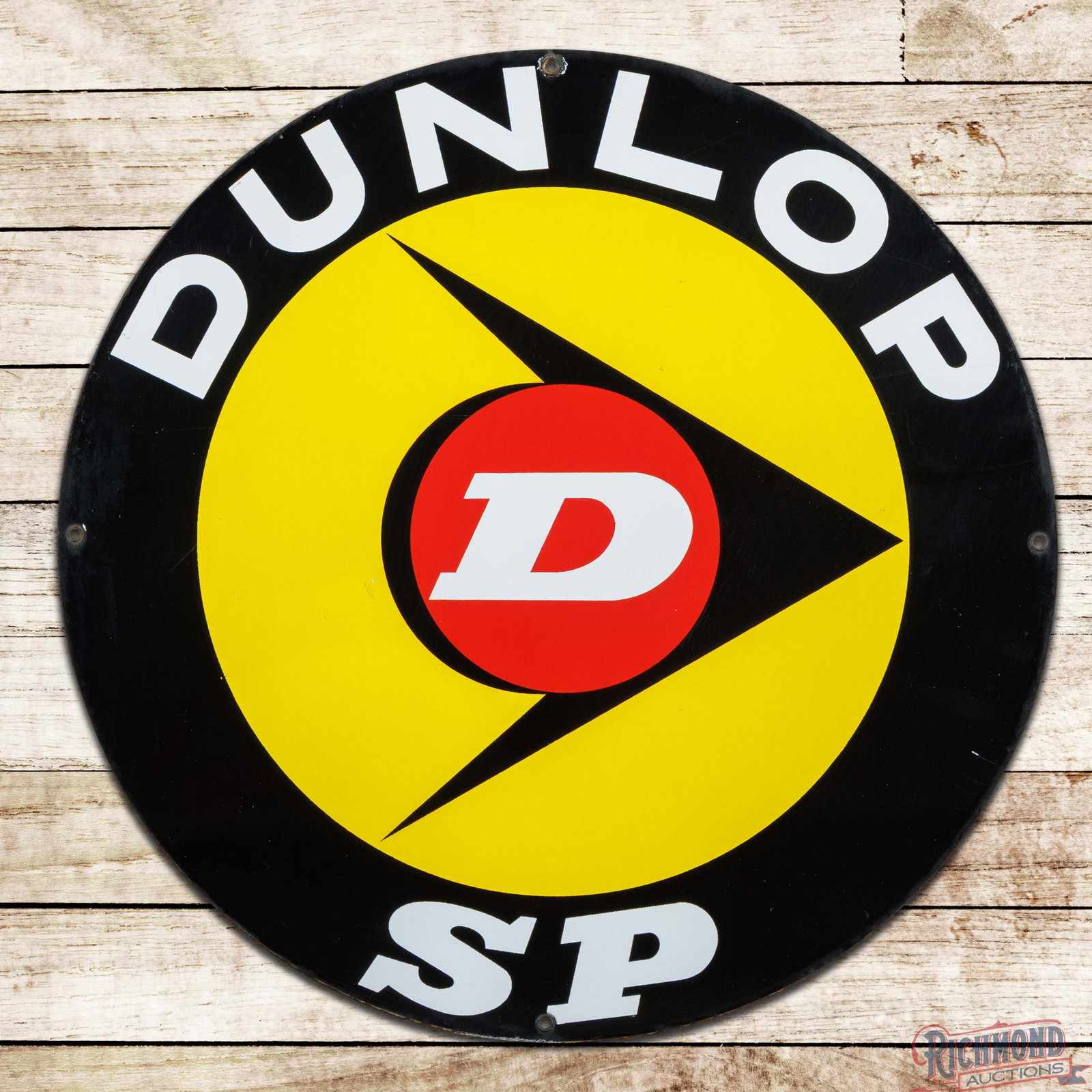 Dunlop SP Tires 27.5" Single Sided Porcelain Sign w/ Logo: SSP (single sided porcelain) sign has excellent color and gloss. The field is very clean overall with minor surface imperfections and a faint indentation to the left of the logo. The perimeter has a c