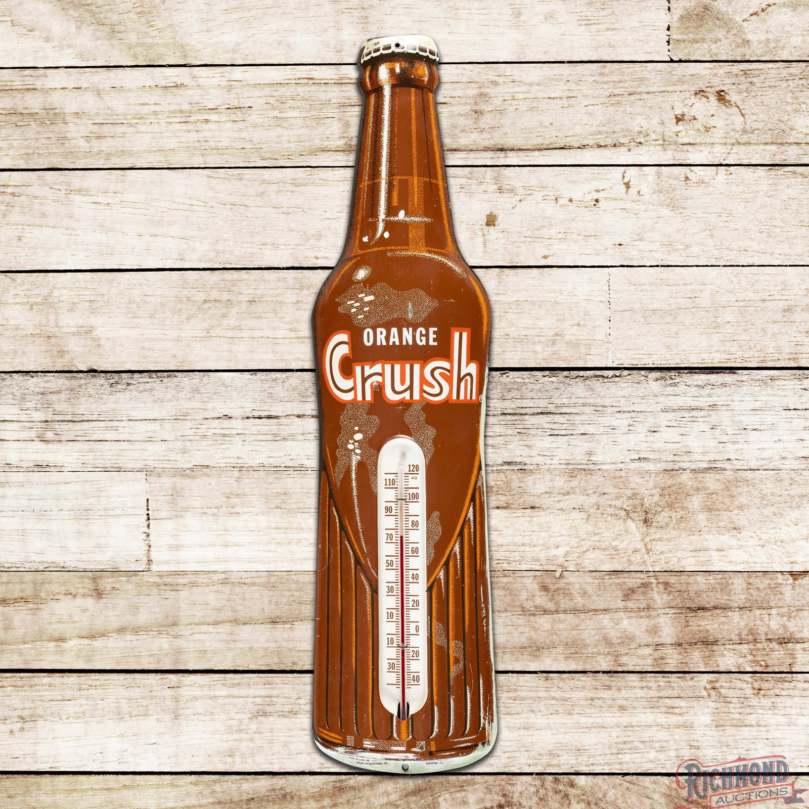 Orange Crush Single Sided Tin Die Cut Advertising Thermometer "Brown Bottle": SST (single sided tin) convex die cut thermometer has good color and shine. The tube is intact and works correctly. The field has scuffs with fine scratches and a paint chip above the "N" in Orange. T