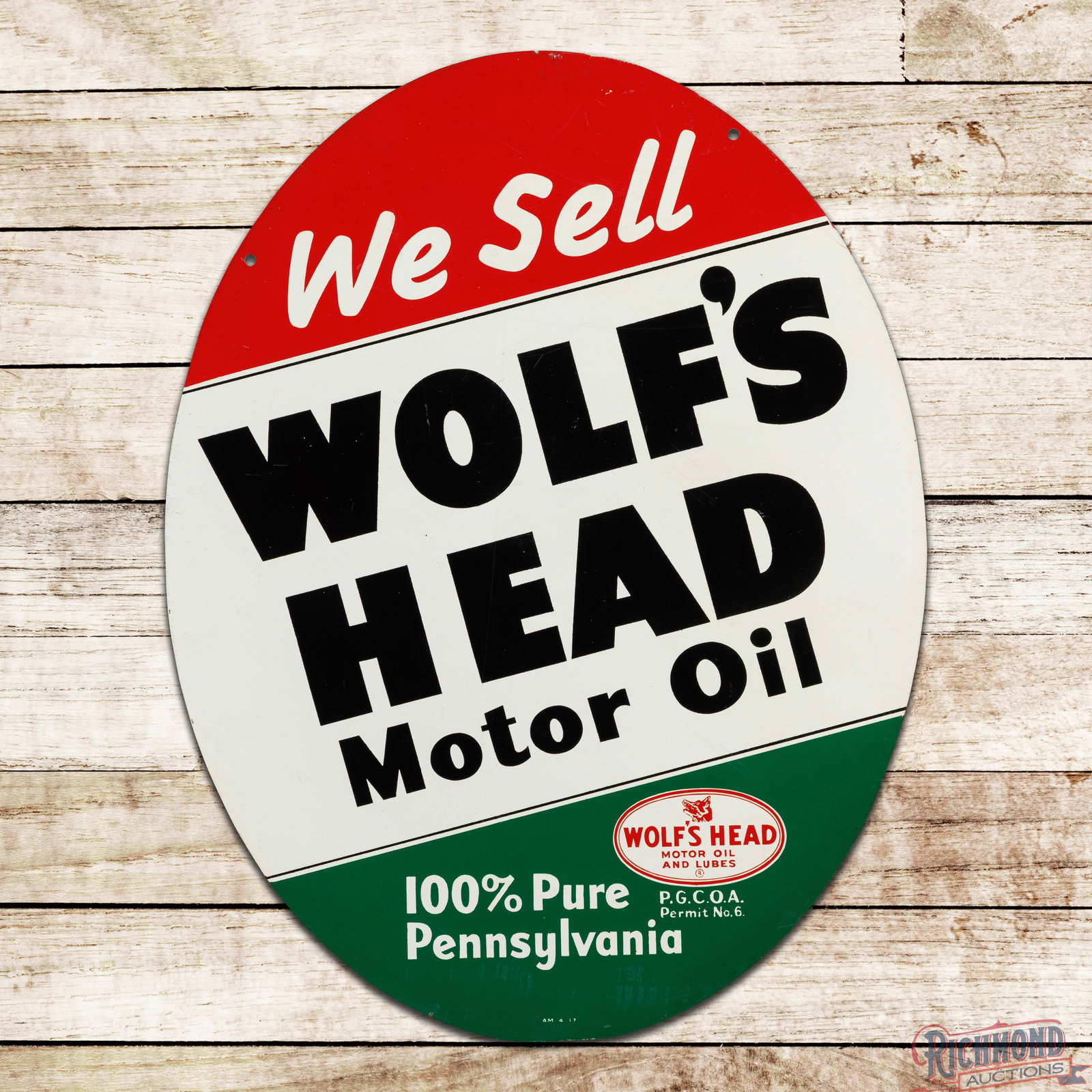 1947 We Sell Wolf's Head Motor Oil "100% Pure Pennsylvania" Double Sided Tin Sign: DST (double sided tin) sign has excellent color and shine. Side #1 has light surface wear and marks with areas of paint blistering. The perimeter has small paint chips with minor wear. The reverse is 