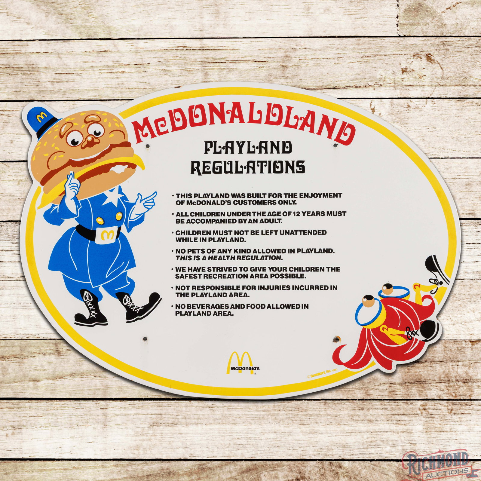 1980 McDonald's Playland Regulations Single Sided Porcelain Sign w/ Logo: SSP (single sided porcelain) die cut sign has excellent color and gloss. The field is clean with small chips at the mounting holes and a few fine scratches on Officer Big Mac in the outer left field. 