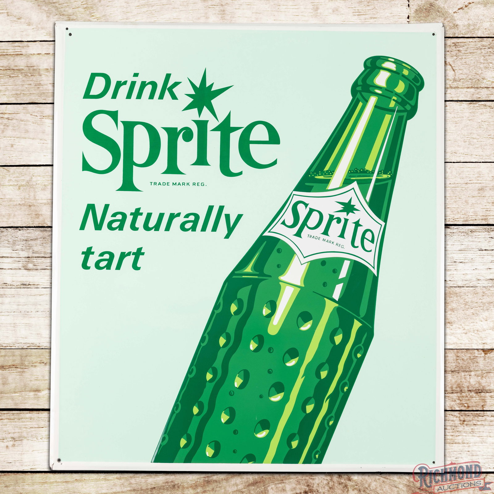 Drink Sprite Naturally Tart Emb. Single Sided Tin Sign w/ Bottle: SST (single sided tin) self-framed sign has outstanding color and shine. The field is exceptionally clean with a few minor surface imperfections. The perimeter has light wear with a few small paint ch