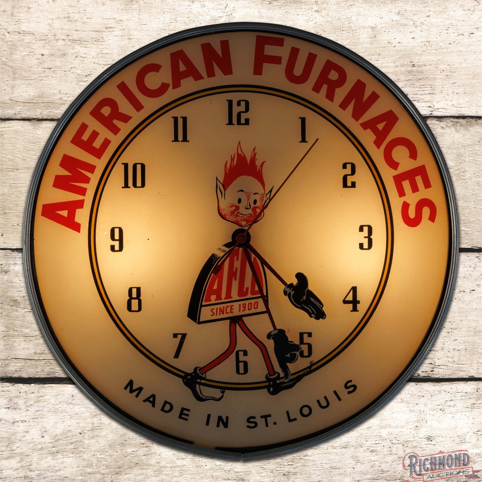 AFCO American Furnaces "Since 1900" 18" Lighted Advertising Clock w/ Mascot: Lighted advertising clock works properly. The inner face features unique hour and minute hands with the company's mascot in the center field. The inner face has light wear with paint chips which are p