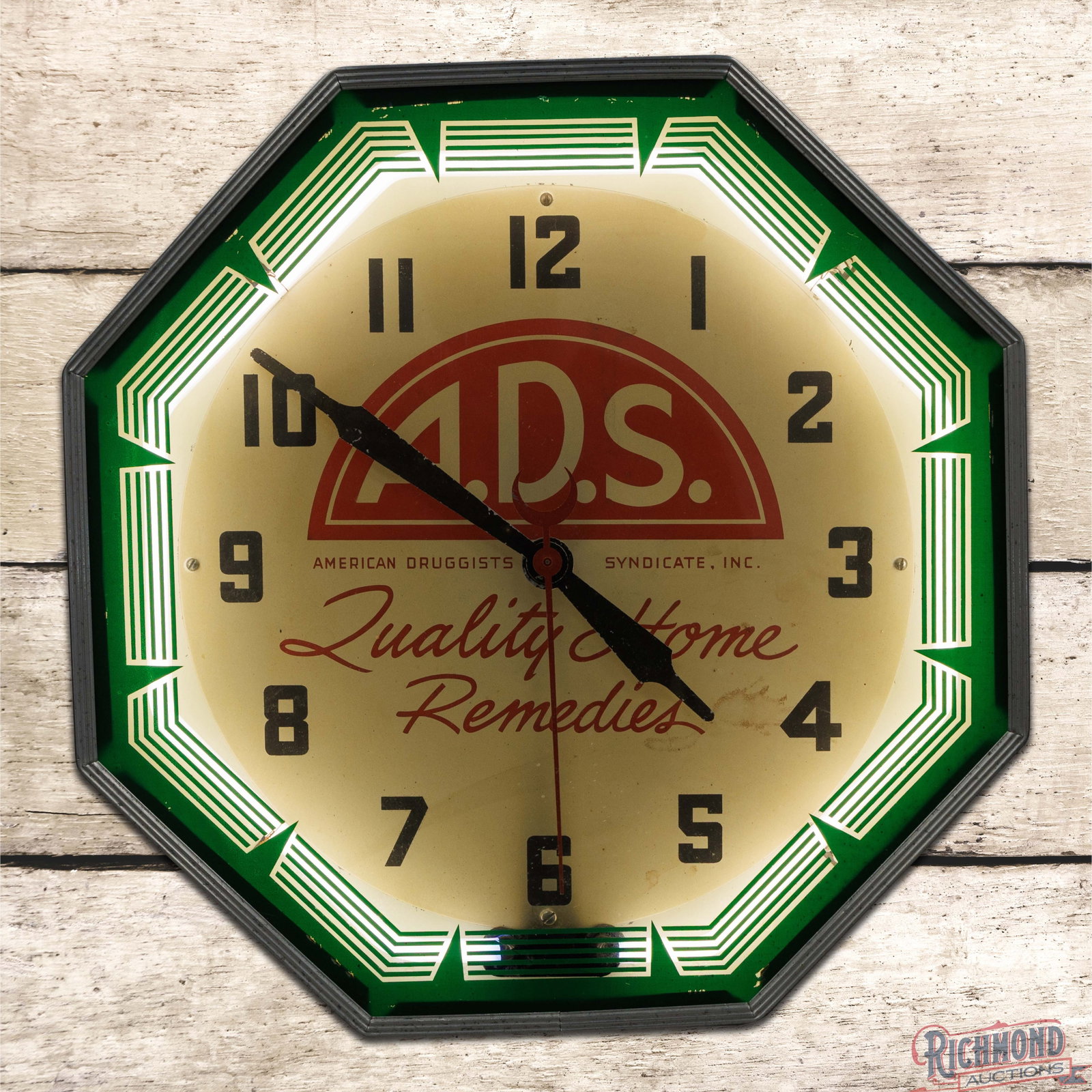 A.D.S American Druggists Syndicate "Quality Home Remedies" 18" Octagon Neon Advertising Clock: Octagon neon advertising clock works properly. The inner face has toning with light wear and areas of discoloration. The hands and outer glass have small paint chips present. The metal can has been re