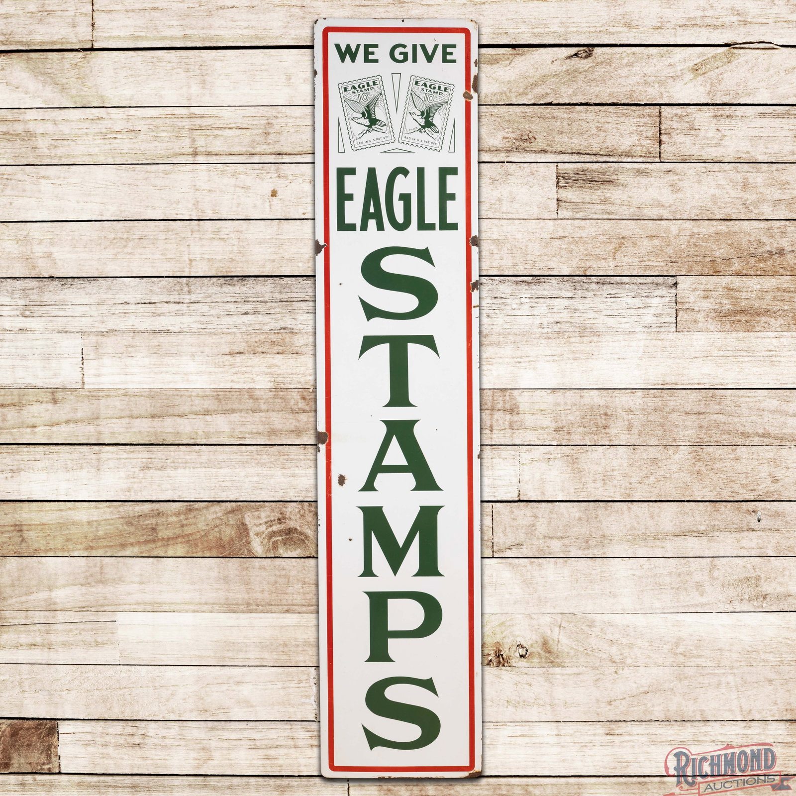 We Give Eagle Stamps 7' Single Sided Porcelain Sign w/ Logo: SSP (single sided porcelain) rolled edge sign has very good color and gloss. The display has light wear with chips. The perimeter has larger chips with scratches and minor crazing. All in all a seldom