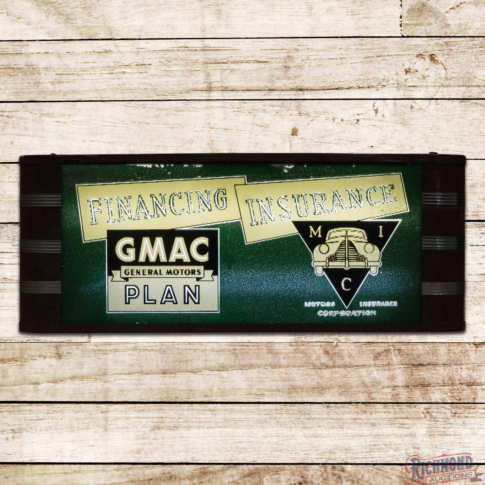 GMAC General Motors Plan Financing Insurance Reverse on Glass Lighted Sign w/ Logo: Reverse on ribbed glass internally lighted sign with the original metal can works as it should. The glass face has small paint chips in the fields with larger paint chips in the outer fields and edges
