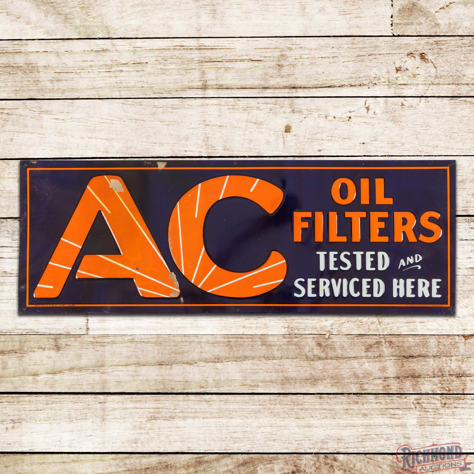 NOS AC Oil Filters "Tested and Serviced Here" Emb. Single Sided Tin Sign: NOS (new old stock) SST (single sided tin) embossed sign has excellent color and shine. The field has small pieces of attached paper with light wear, paper marks and a paint chip on the "A" of AC. Mar