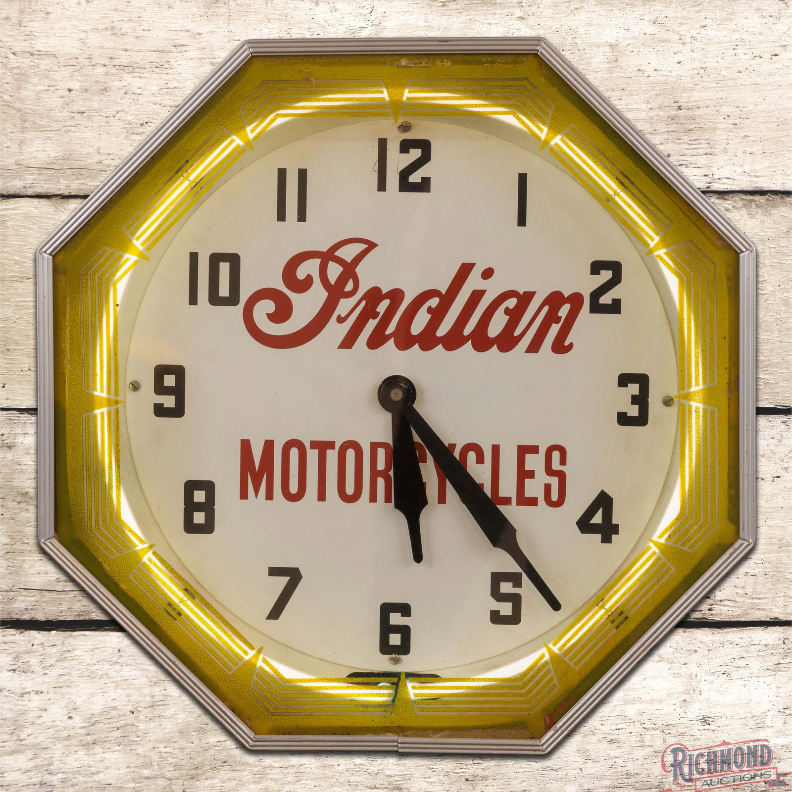 Indian Motorcycles 18" Neon Advertising Clock: Neon Products Inc. octagon neon clock works as it should. The inner face is a replacement. It shows light wear with small scratches and minor color match in the "12". The second hand is missing and th