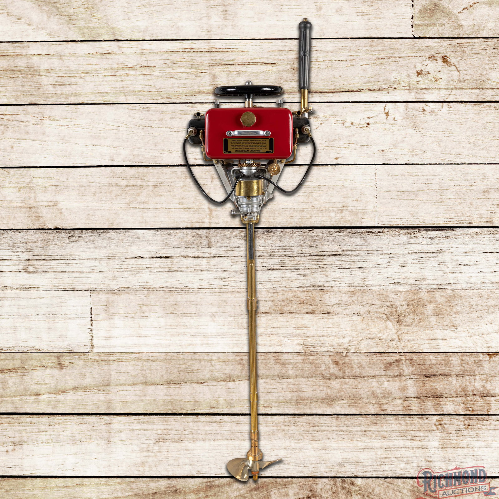 Caille Liberty Twin Professionally Restored Outboard Motor Display: Caille Liberty Twin outboard motor with wood wall mount display has been professionally restored. The motor features detailed appointments, new decals, and areas of light wear. The motor has been secu