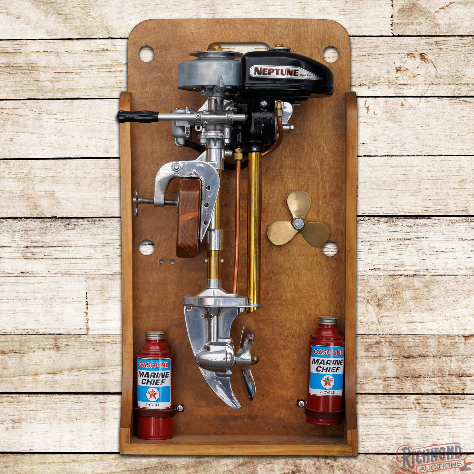 Neptune Mighty Mite Outboard Engine Display: Neptune Mighty Mite engine has been professionally restored and mounted to a custom wood display. The display is clean and features a propeller and custom Texaco Marine Chief Gasoline cans. Overall a 