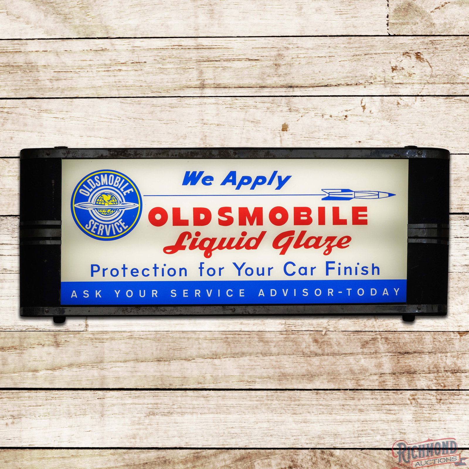 We Apply Oldsmobile Liquid Glaze "Protection for your Car Finish" Reverse on Glass Lighted Sign: Reverse on glass internally lighted sign with the original metal can works properly. The glass face has been replaced. It features vibrant color with the Oldsmobile Service and Olds Rocket logos. The 