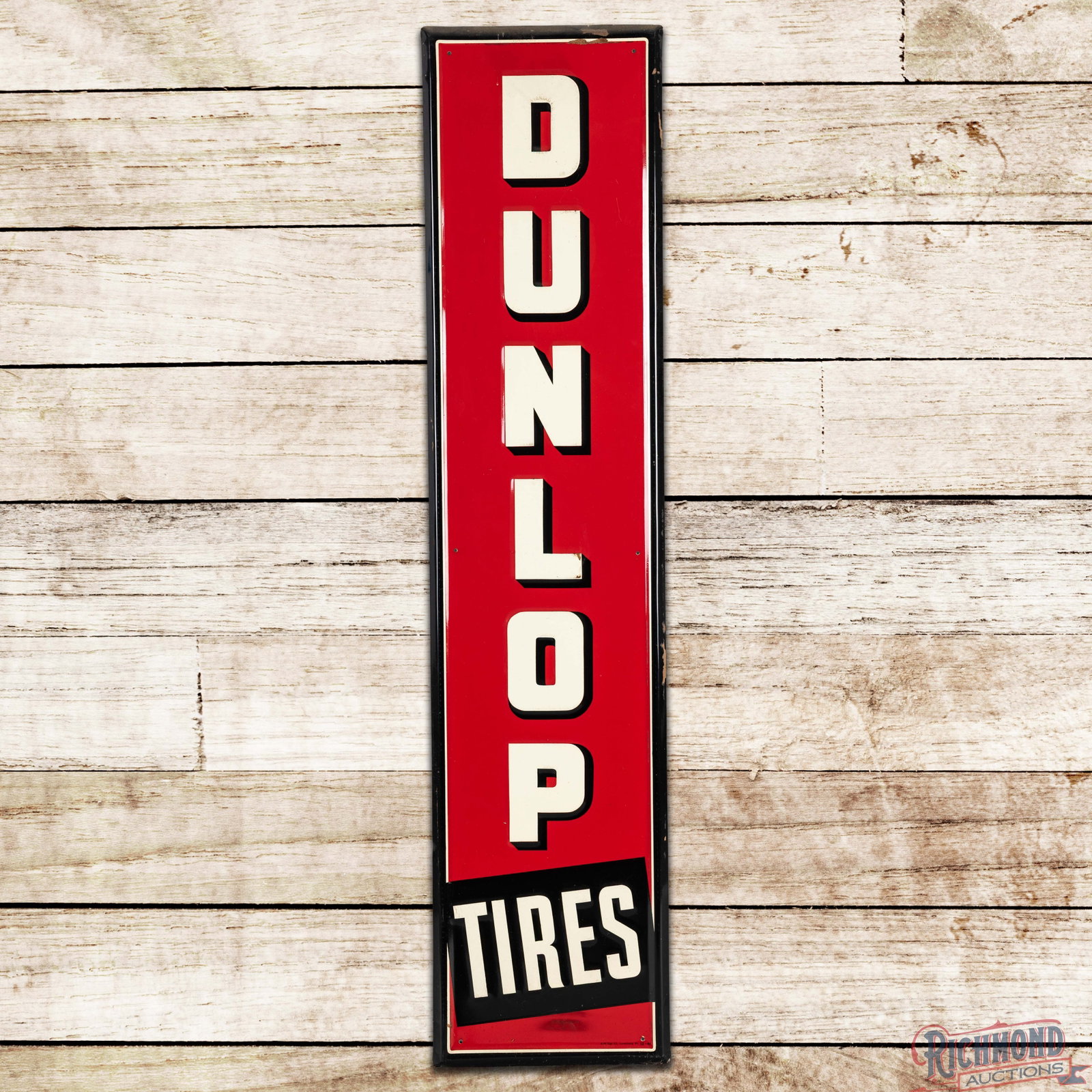 NOS 1941 Dunlop Tires 5' Emb. Single Sided Tin Sign: SST (single sided tin) embossed sign has excellent color and shine. The field has minor surface imperfections with small pieces of attached factory paper on the lettering. The perimeter has an area of