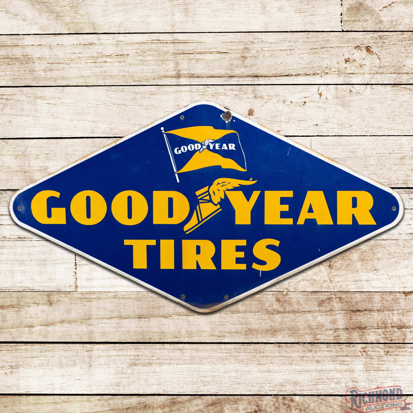 Goodyear Tires 6' Single Sided Porcelain Sign w/ Wingfoot & Flag: SSP (single sided porcelain) die cut sign has excellent color and gloss. The field has light wear with errant paint drips. The perimeter has a chip at the upper right mount hole, a few tiny edge chips