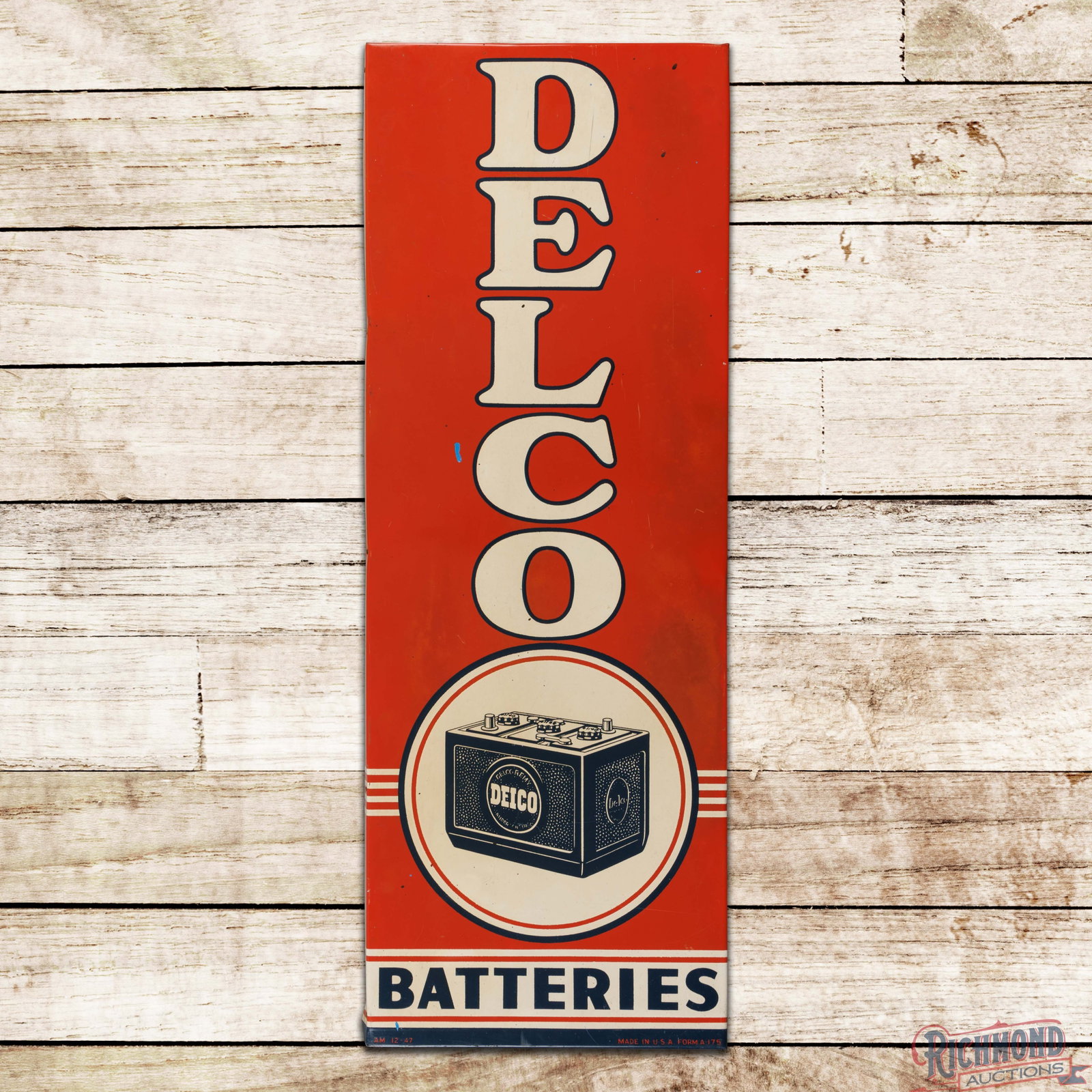 1947 Delco Batteries Single Sided Tin Sign "Small": SST (single sided tin) sign with a factory wooden support frame has good color and shine. The field has light wear with errant paint drips and fine scratches. The outer fields have areas of discolorat