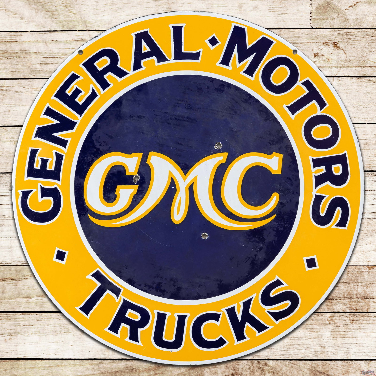 GMC General Motors Trucks 30" Double Sided Porcelain Sign: DSP (double sided porcelain) sign has very good color and gloss. The display has light wear with small chips and three non-factory holes in the field. The perimeter has minor chips along the upper edg
