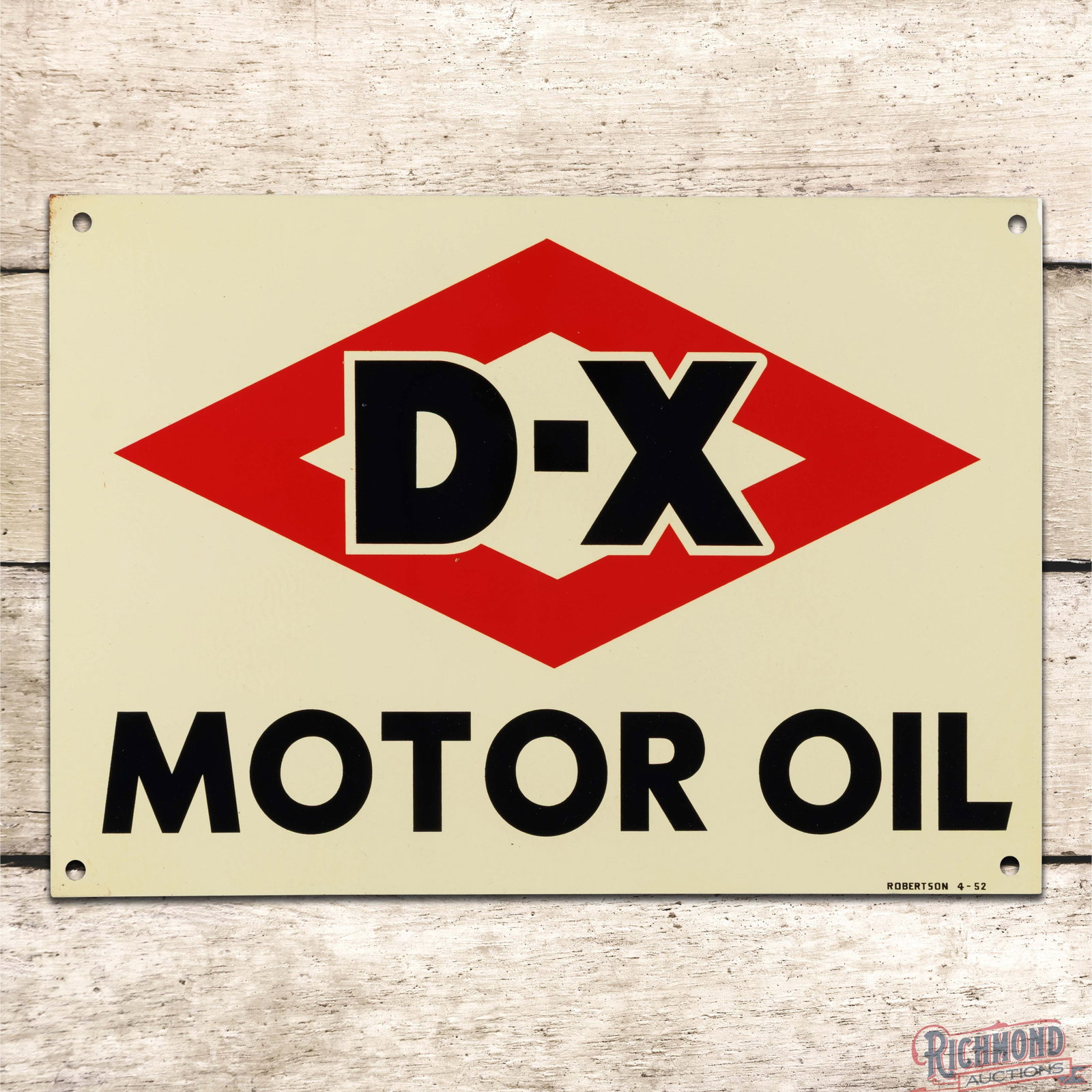 1952 D-X Motor Oil Single Sided Tin Logo Sign: SST (single sided tin) sign has outstanding color and shine. The field is clean with faint paper marks and two tiny raised factory paint blemishes. The perimeter has a small area of oxidation on the u