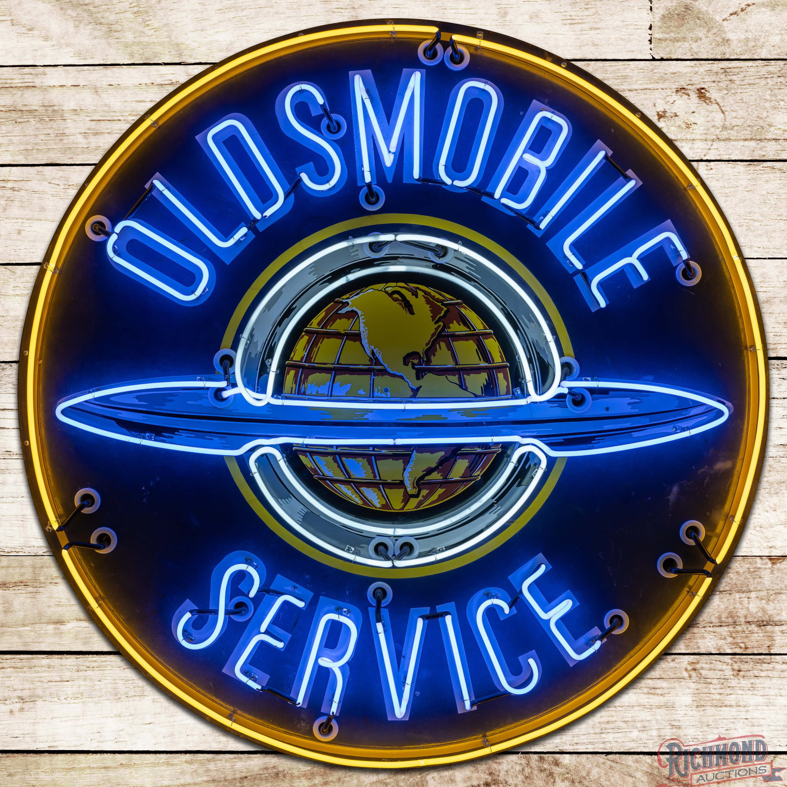 Oldsmobile Service 5' Single Sided Porcelain Neon Sign w/ World Logo: SSP (single sided porcelain) sign with added neon and a metal can has good color and gloss. The display has small chips with fine scratches, marks and areas of cloudiness in the outer fields. The peri