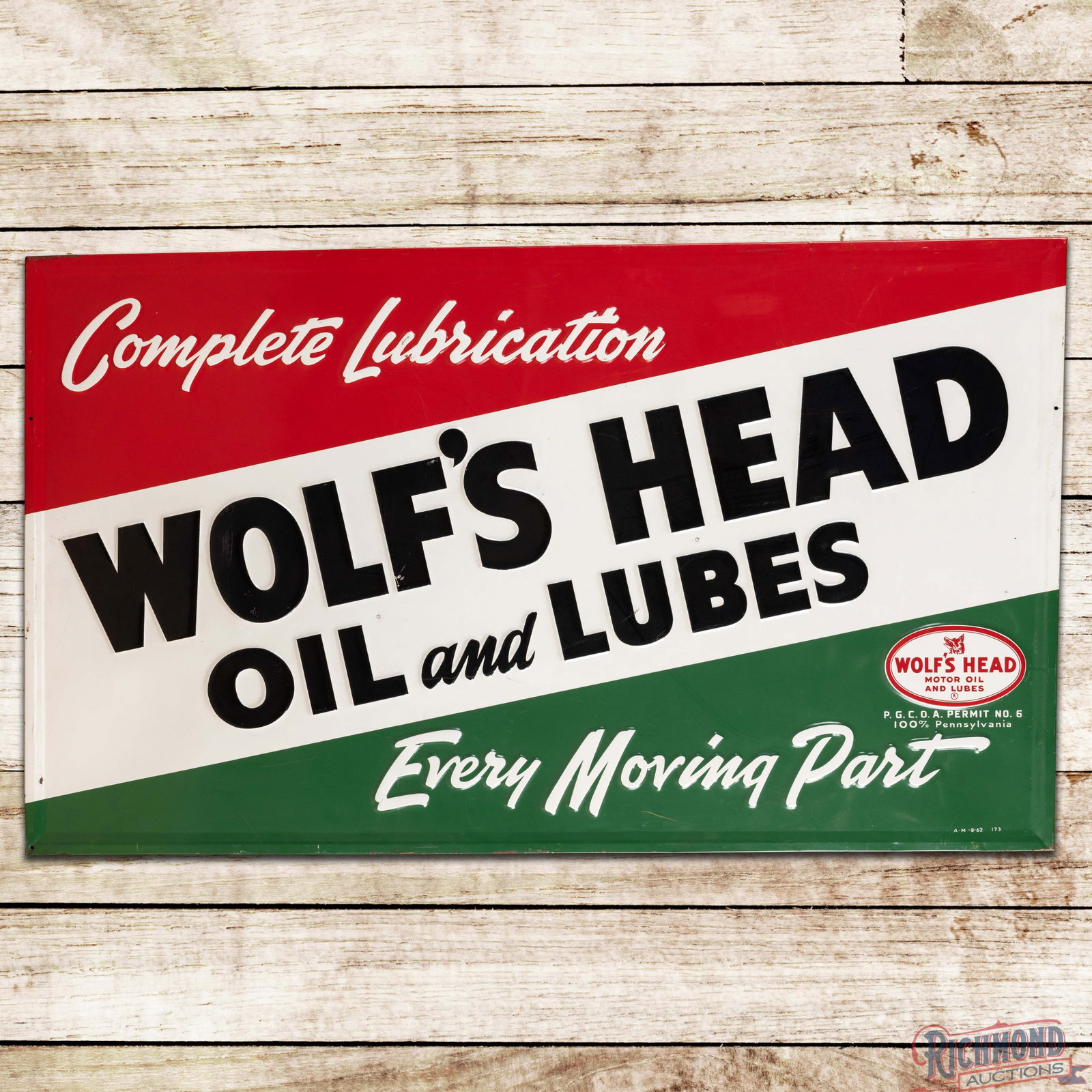 1962 Complete Lubrication Wolf's Head Motor Oil and Lubes 5' Emb. Single Sided Tin Sign: SST (single sided tin) embossed self-framed sign with the factory wooden support frame has excellent color and shine. The display has light wear with small scuffs and fine scratches. The perimeter has