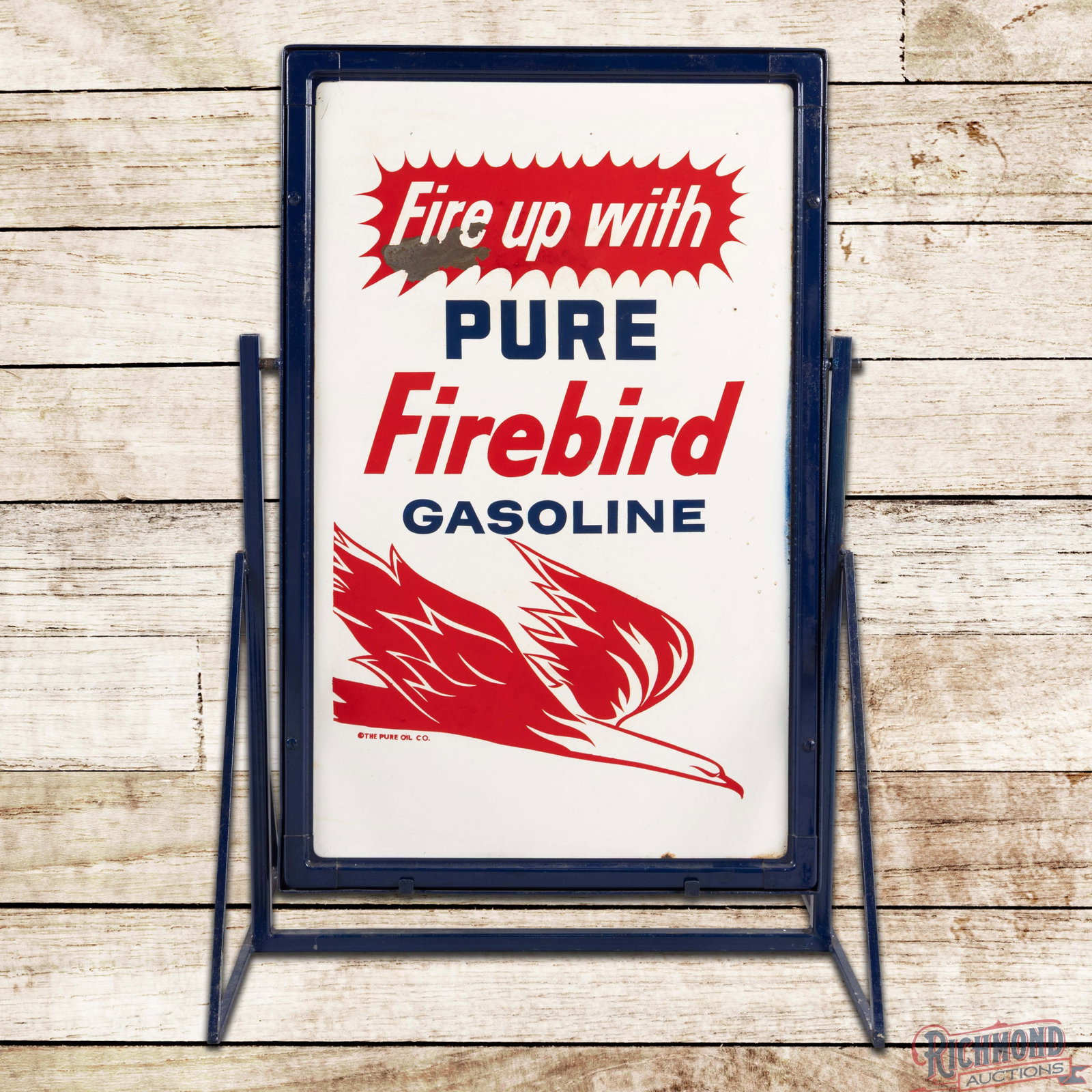 Fire Up with Pure Firebird Gasoline Double Sided Tin Curb Sign w/ Stand: DST (double sided tin) sign with the factory frame and stand has very good color and shine. The display has light wear with small paint chips. The perimeter has errant blue paint on the lower right ed