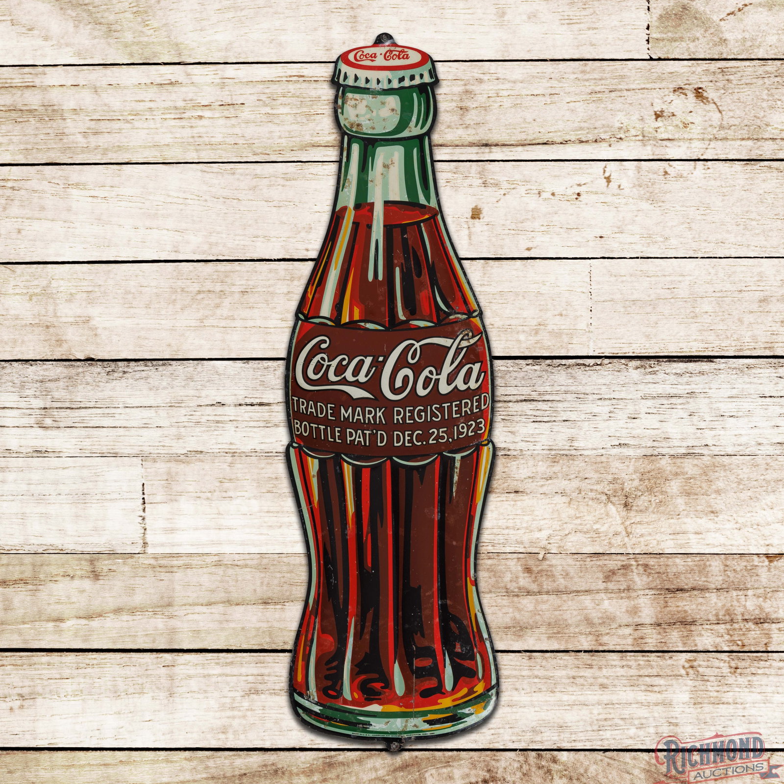 1932 Coca Cola 39" Emb. Die Cut Christmas Bottle Sign: SST (single sided tin) embossed die cut Coke bottle sign has good color and shine. The fields have fine scratches, discoloration and areas of oxidation. The perimeter has paint chips with minor bends.