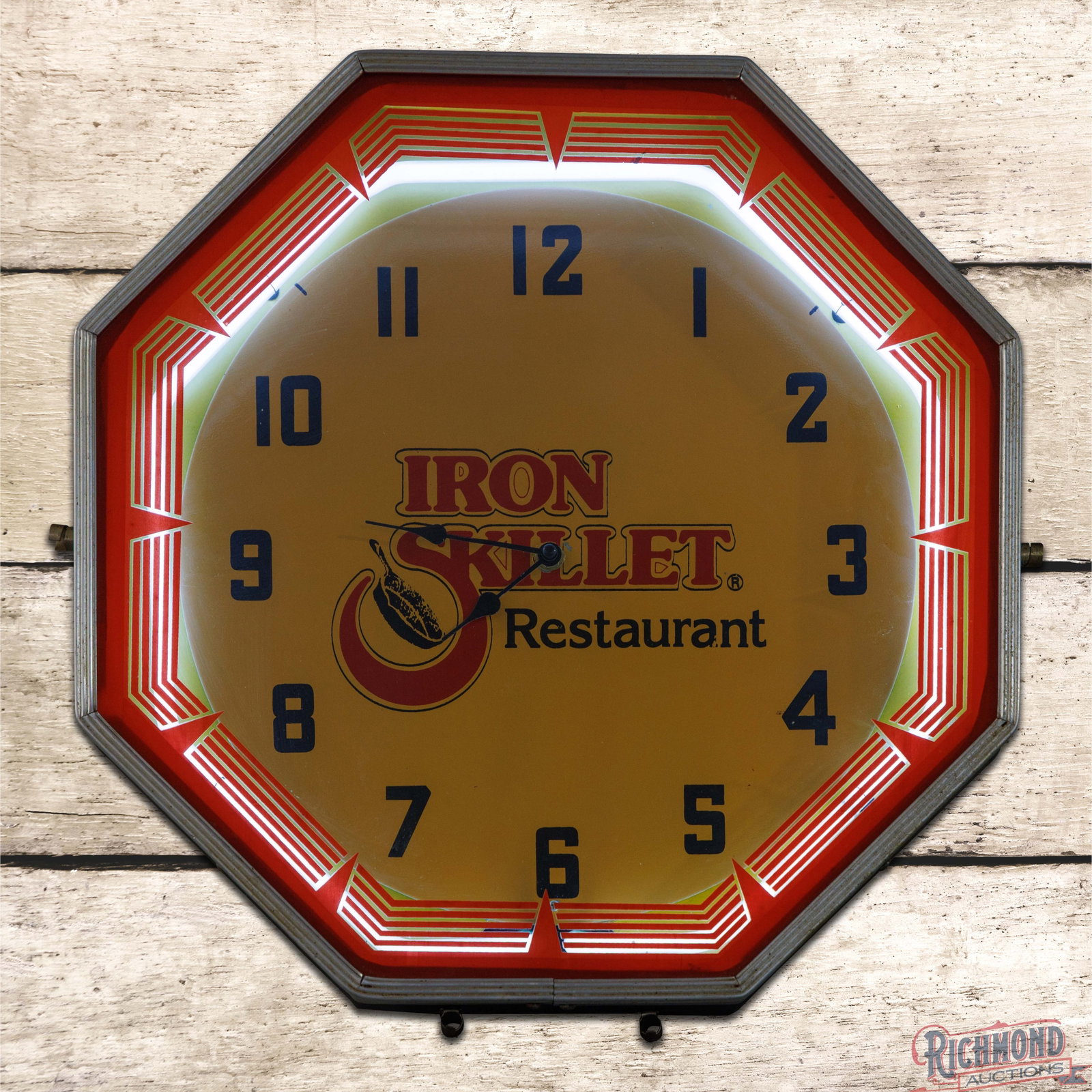 Iron Skillet Restaurant 18" Neon Advertising Clock: Octagon neon advertising clock has very good color. The neon works as it should and the factory clock motor has been replaced by a battery-powered unit. The inner face is a replacement and presents wi