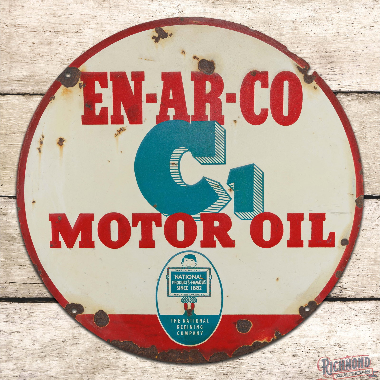 Enarco C1 Motor Oil 24" Emb. Single Sided Tin Sign w/ Boy & Slate Logo: SST (single sided tin) embossed sign has moderate color and shine. The field exhibits general wear with fading, oxidation and paint chips. The perimeter has larger paint chips, minor bends and a small