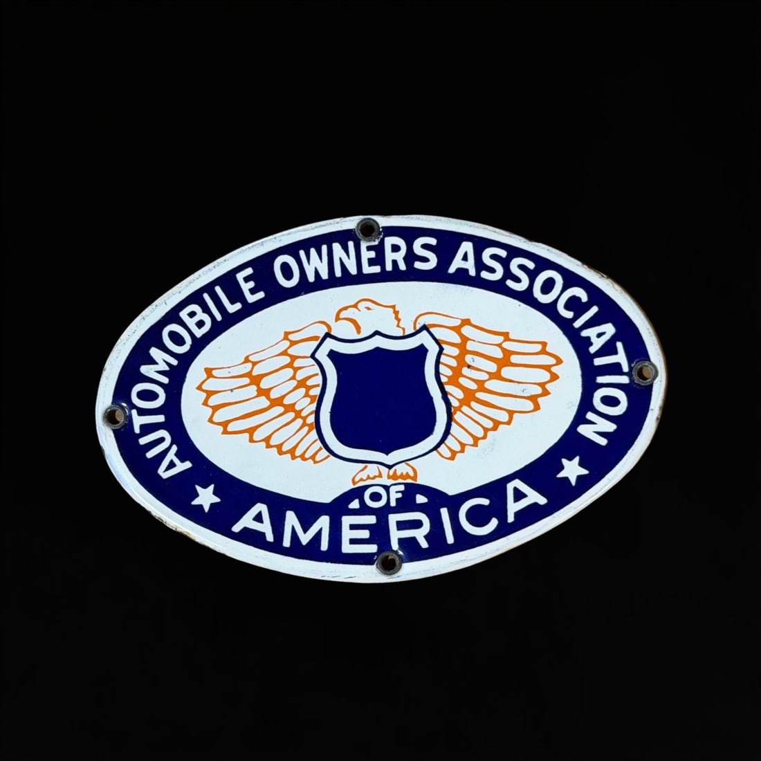 Automobile Owners Association Of American Porcelain Sign: Clean with light shelf wear throughout. 5" H x 3" W. All items are eligible for free delivery to Rustbelt Americana in East Moline, IL on 8/6-7 or other shows that Richmond Auctions attends. Size 5"