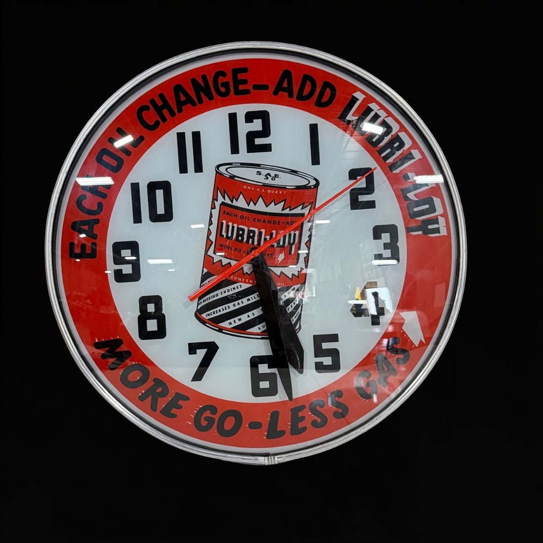 Lubriloy More Go Less Gas Light Up Clock: Built by Lackner, clean face, works as it should. 19" H x 5" W. All items are eligible for free delivery to Rustbelt Americana in East Moline, IL on 8/6-7 or other shows that Richmond Auctions attends