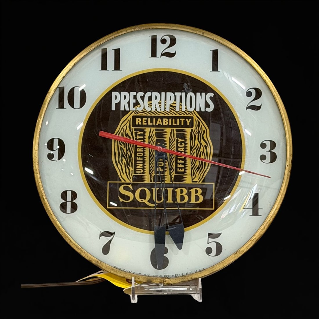 Squibb Prescriptions Light Up Clock: Works as it should. Face has some wear. 15" H. All items are eligible for free delivery to Rustbelt Americana in East Moline, IL on 8/6-7 or other shows that Richmond Auctions attends. Size 15" H Medi