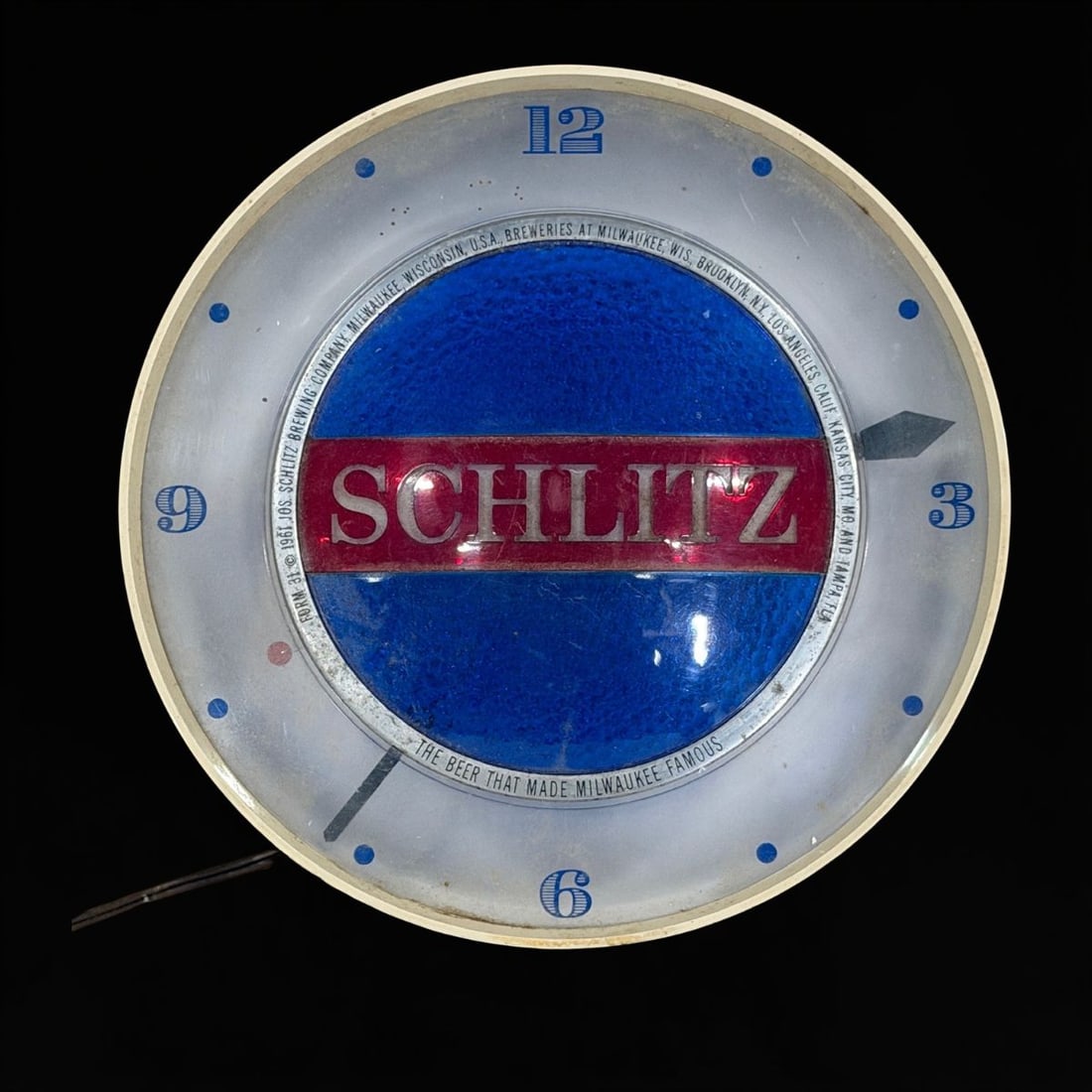 Schlitz Spinning Light Up Clock: Mechanism and light both are working. Really neat spinner piece. Face has wear. 9" H x 6" W. All items are eligible for free delivery to Rustbelt Americana in East Moline, IL on 8/6-7 or other shows