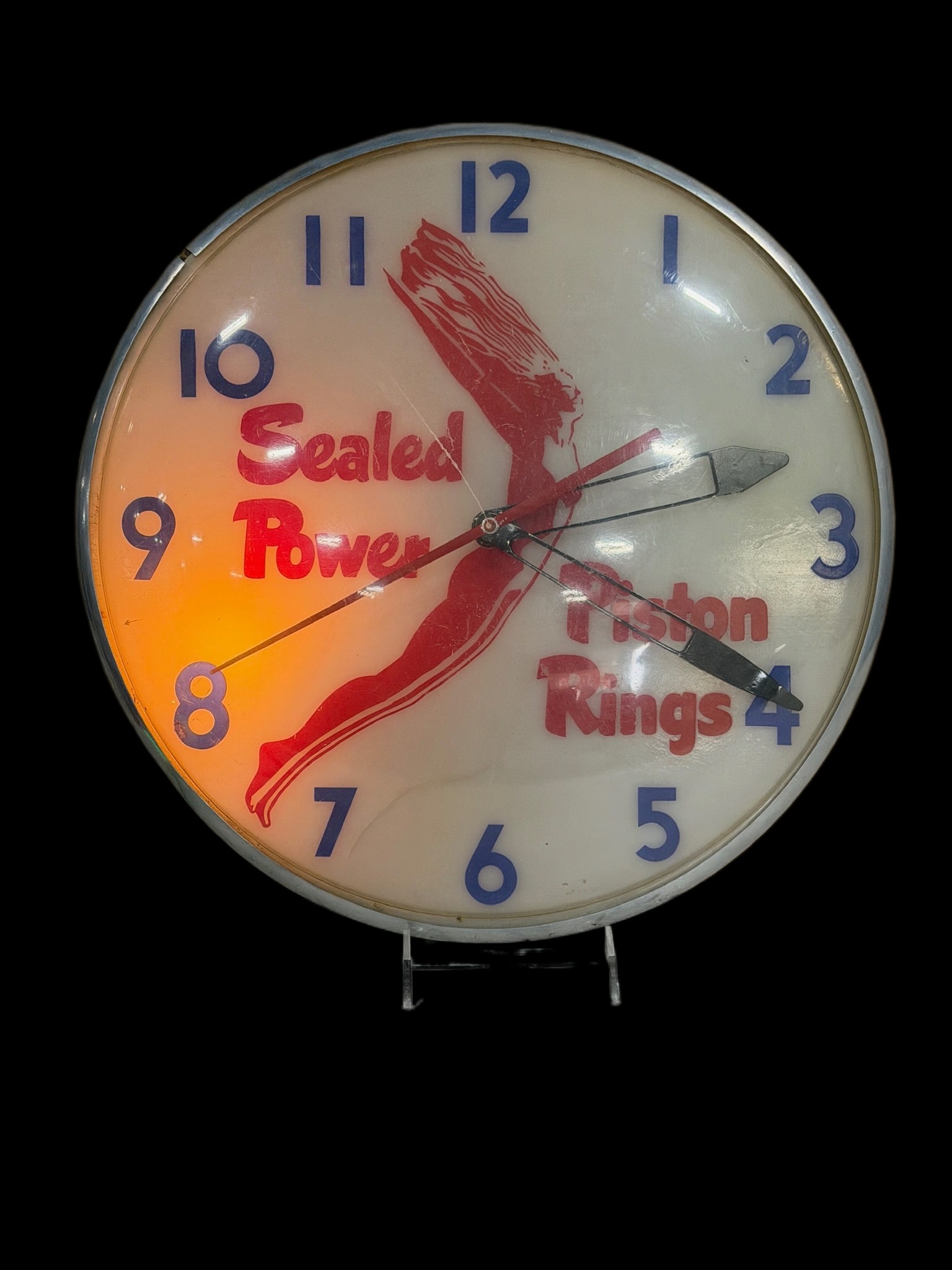 Sealed Power Piston Ring Clock: Only has 1 light socket. Clock mechanism works but hands are laying on the face. Plastic cover has a lot of scratches. 16" H x 16" W x 3" D. All items are eligible for free delivery to Rustbelt Americ