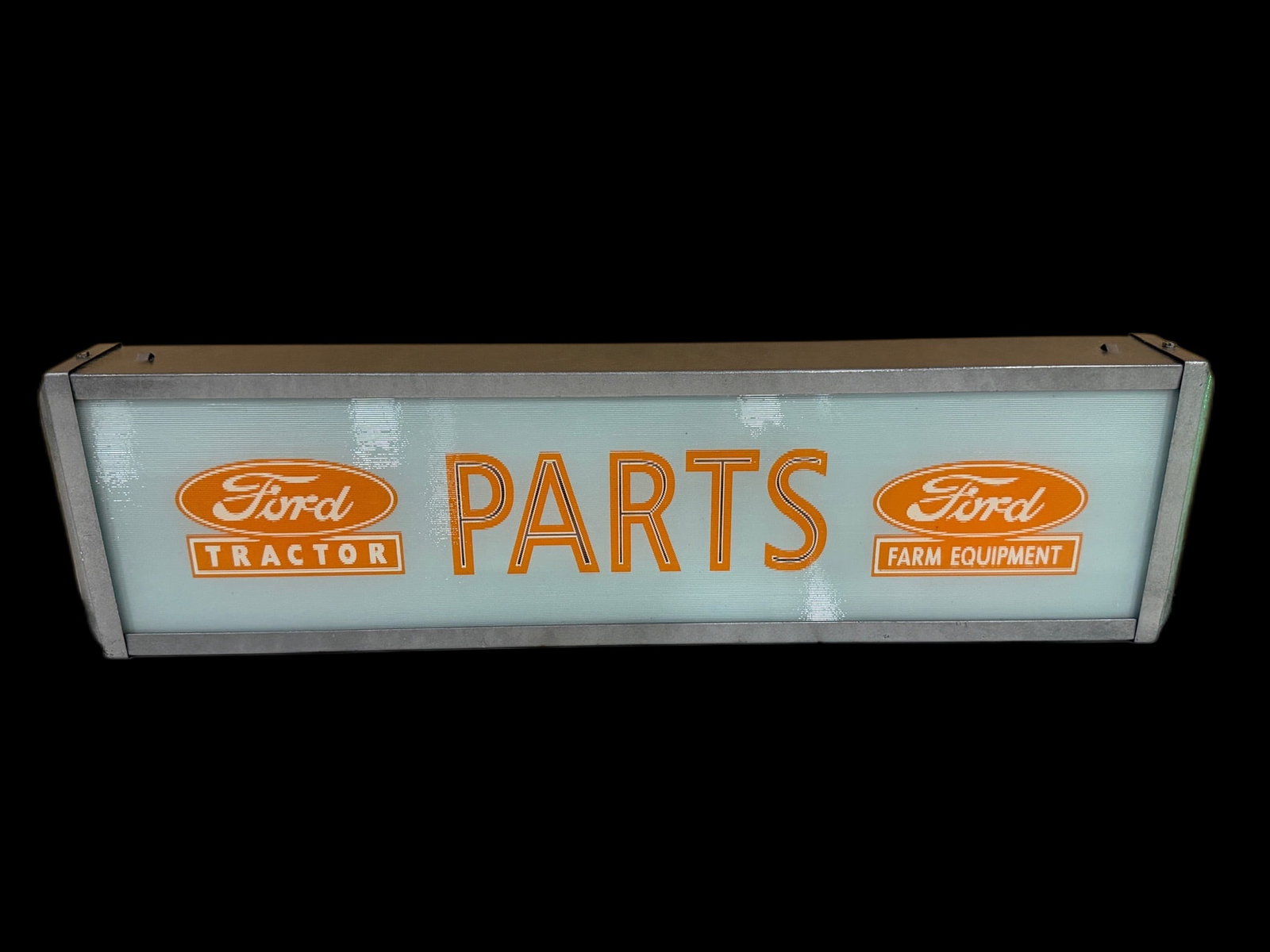 Ford Tractor Parts Table Top Display Sign: Restored housing. Don't believe face to be old. Displays excellent. 25" H x 6" W x 3" D. All items are eligible for free delivery to Rustbelt Americana in East Moline, IL on 8/6-7 or other shows that