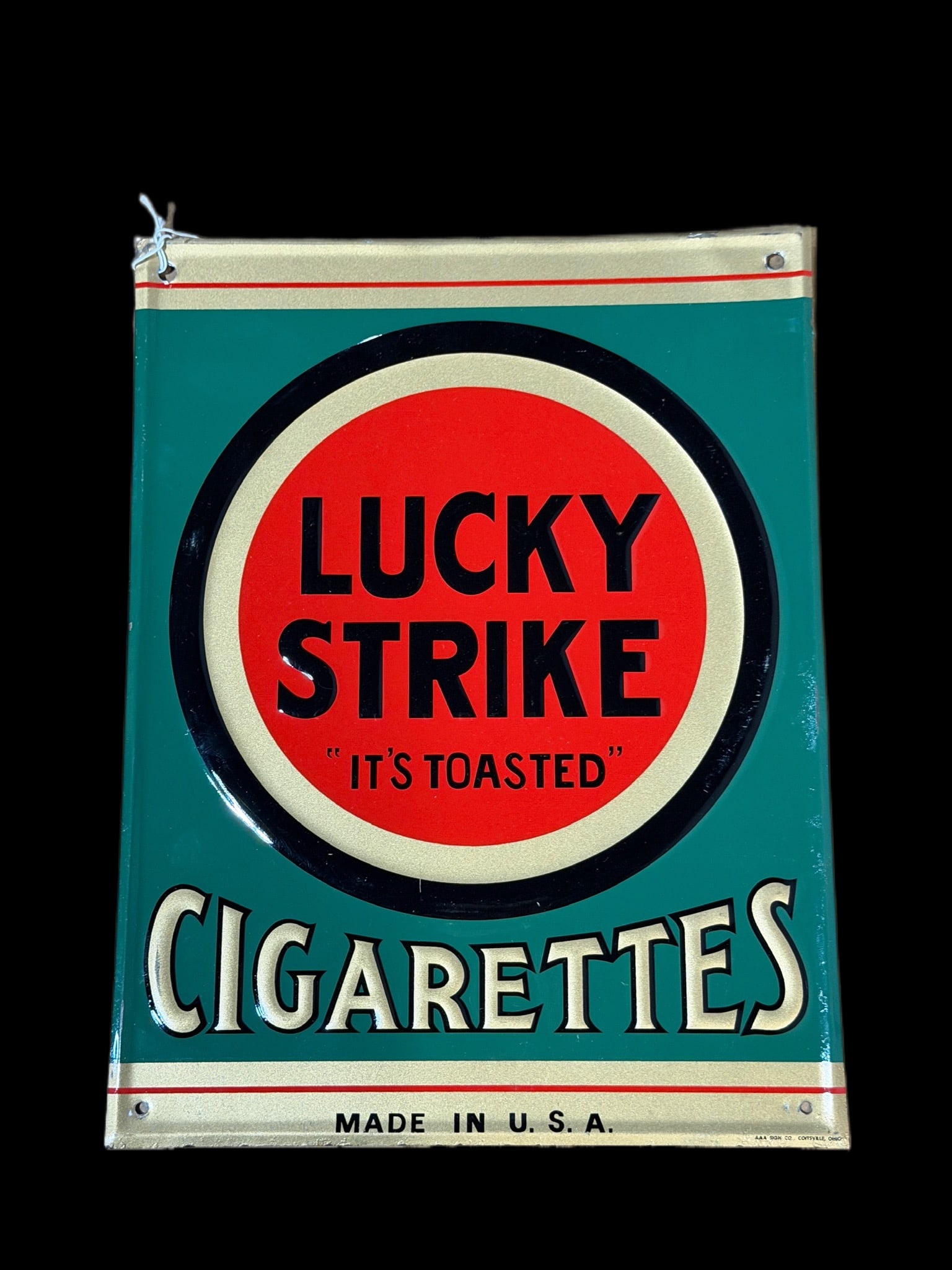 Lucky Strike Cigarettes Tobacco Metal Sign: Marked AAA sign company. Surface wear throughout. 13" H x 10" W. All items are eligible for free delivery to Rustbelt Americana in East Moline, IL on 8/6-7 or other shows that Richmond Auctions