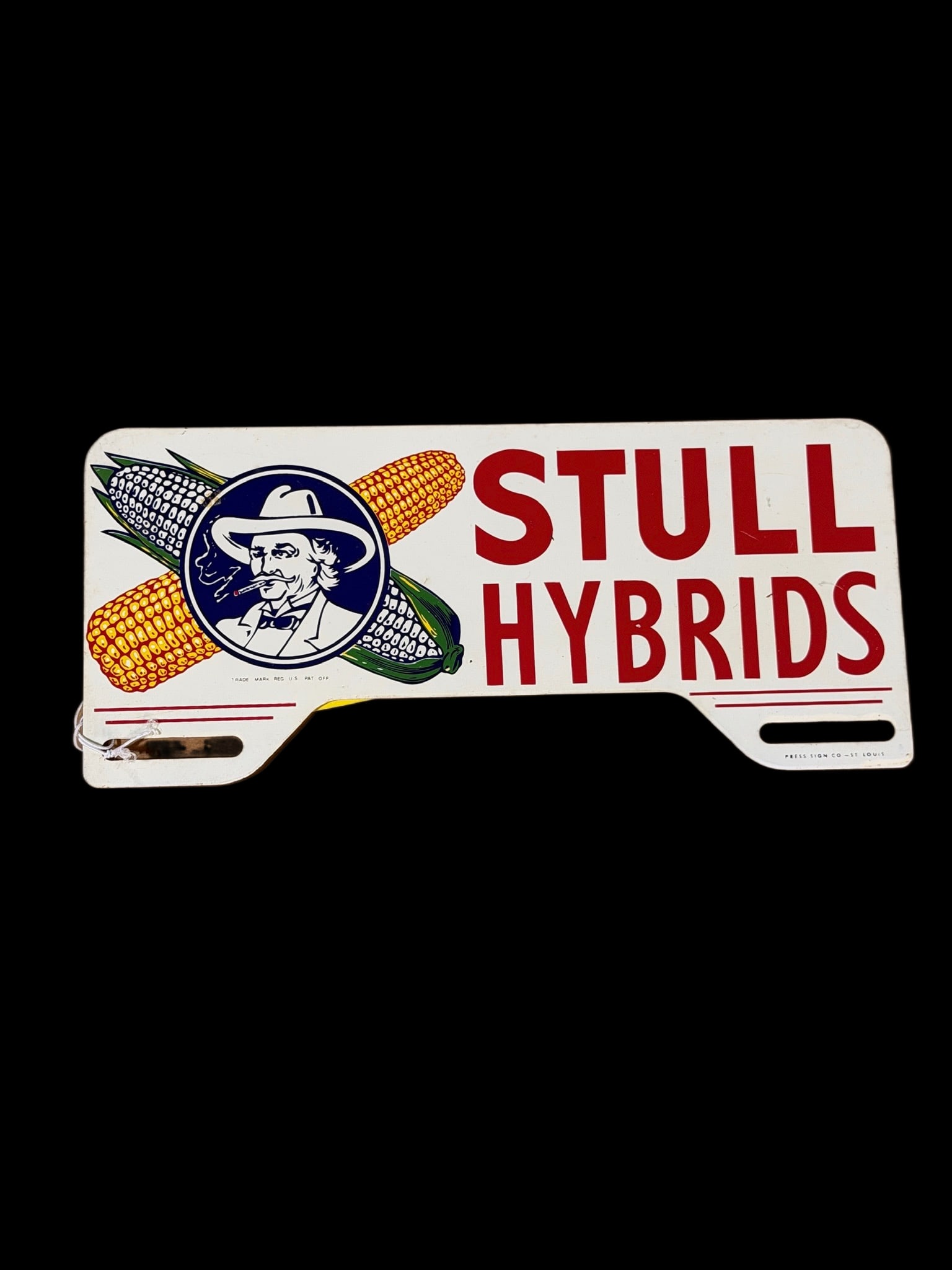 Stull Hybrids License Topper: Marked Press sign co st Louis. Light scratches and a small blemish at 11 o'clock on blue logo. 10" H x 5" W. All items are eligible for free delivery to Rustbelt Americana in East Moline, IL on 8/6-7