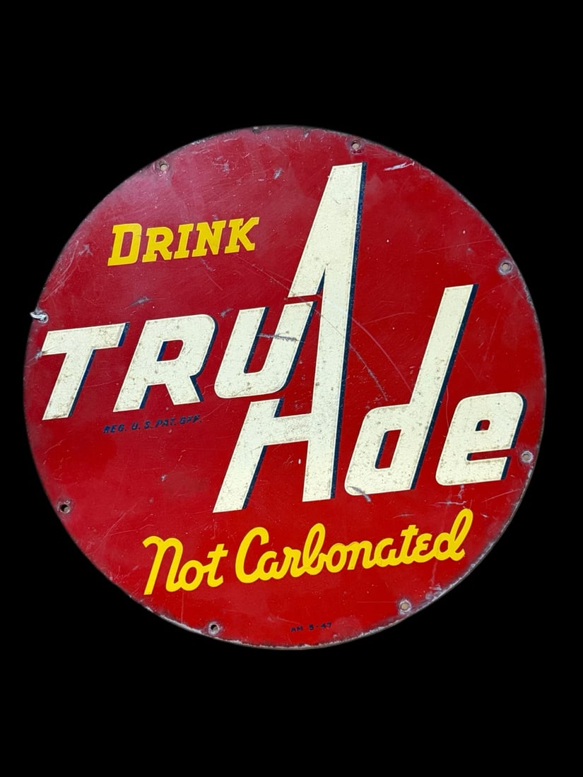 TruAde Not Carbonated Tin Sign: AM 5-47 Heavy scratching throughout. 14" H. All items are eligible for free delivery to Rustbelt Americana in East Moline, IL on 8/6-7 or other shows that Richmond Auctions attends. Size 14" H Medium 