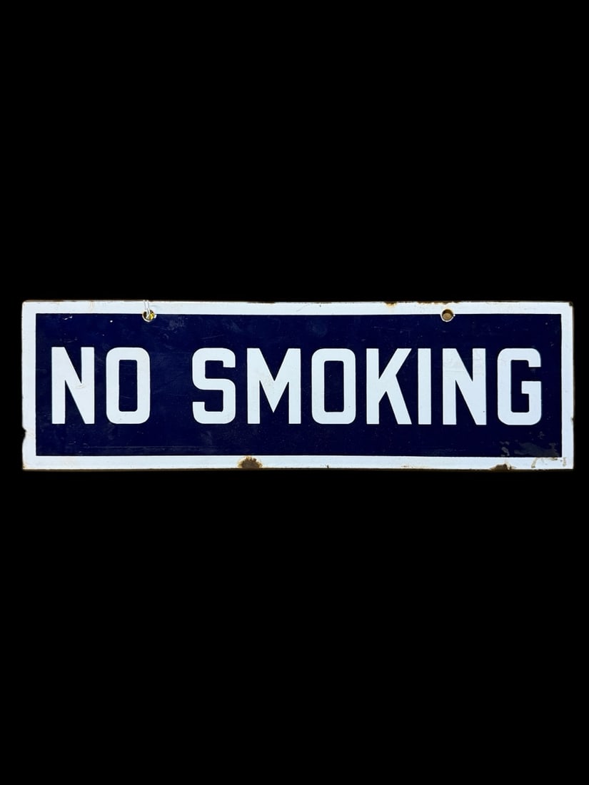 No Smoking Porcelain Sign: Chips on bottom edge and shelf wear present throughout. 18" H x 5" W. All items are eligible for free delivery to Rustbelt Americana in East Moline, IL on 8/6-7 or other shows that Richmond Auctions a