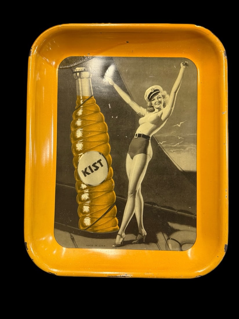 Kist Soda Serving Tray Sign: Chips around top edges. Scratches in field. 10" H x 13" W x 1" D. All items are eligible for free delivery to Rustbelt Americana in East Moline, IL on 8/6-7 or other shows that Richmond Auctions