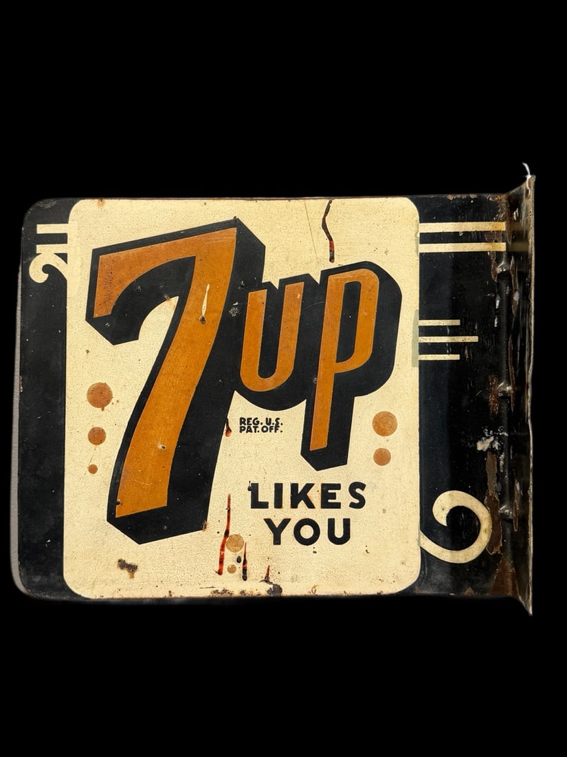 7Up Likes You Flange Sign: Lots of fade, scratches and a crease. Marked Stout Sign. 10" H x 12" W x 1" D. All items are eligible for free delivery to Rustbelt Americana in East Moline, IL on 8/6-7 or other shows that Richmond A