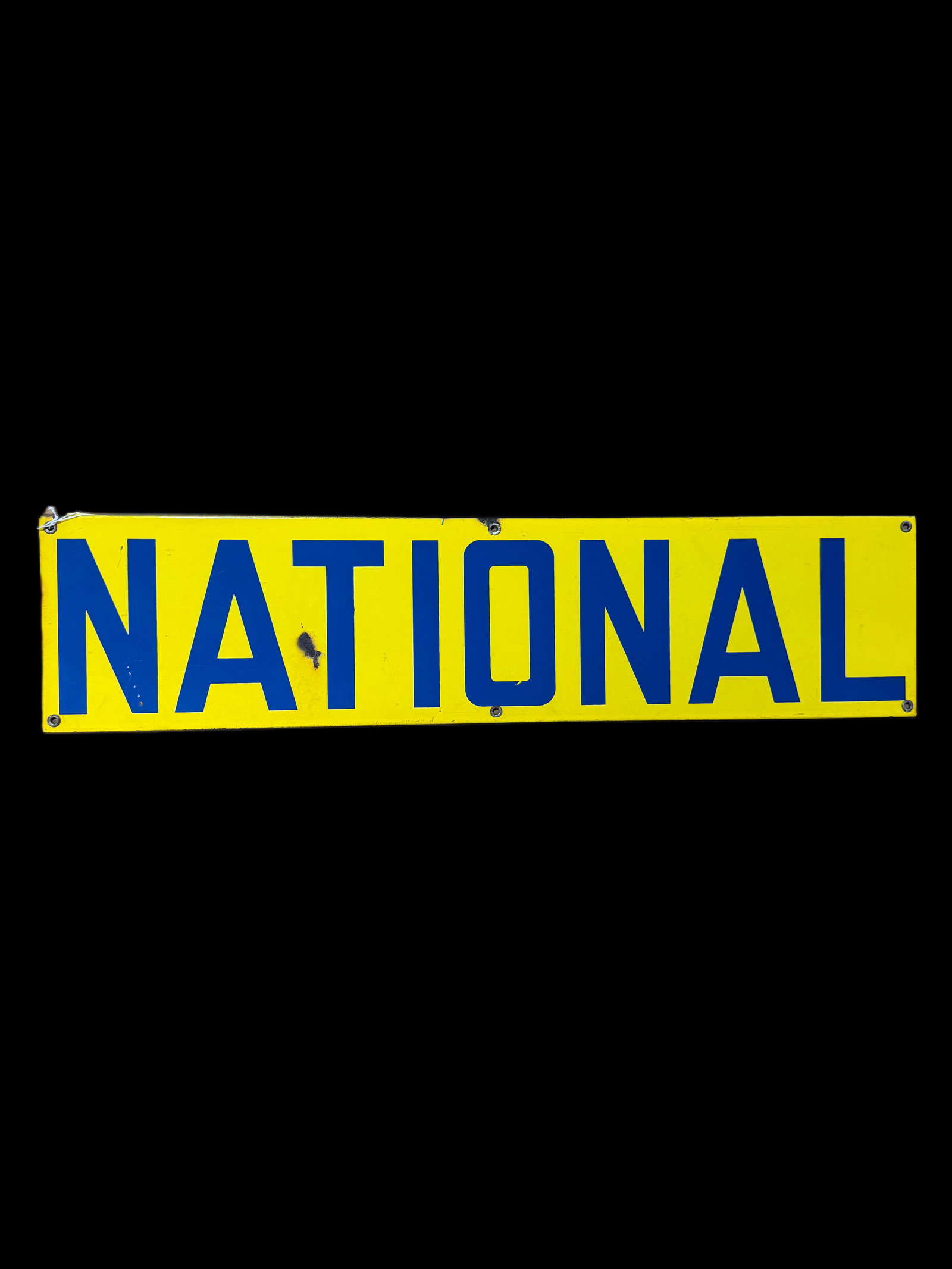 National Porcelain Sign: Chip after the A. Wear around edges and light scratching in field. 7" H x 29" W. All items are eligible for free delivery to Rustbelt Americana in East Moline, IL on 8/6-7 or other shows that