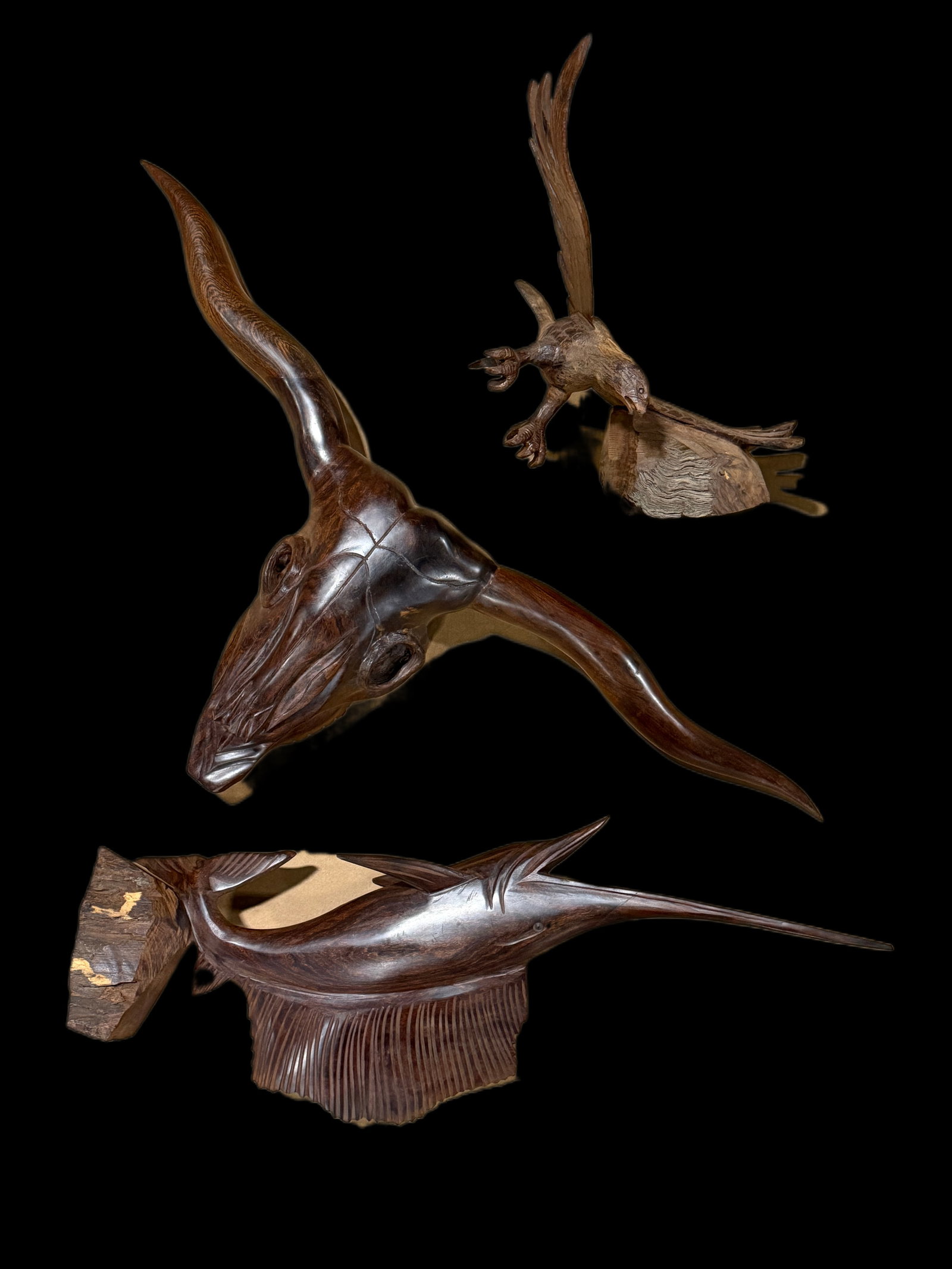 3 Wooden Carved Sculptures Sailfish Hawk Longhorn Bull: 3 wood sculptures, age unknown. 35" H x 13" W. All items are eligible for free delivery to Rustbelt Americana in East Moline, IL on 8/6-7 or other shows that Richmond Auctions attends. Size 35" H x 13