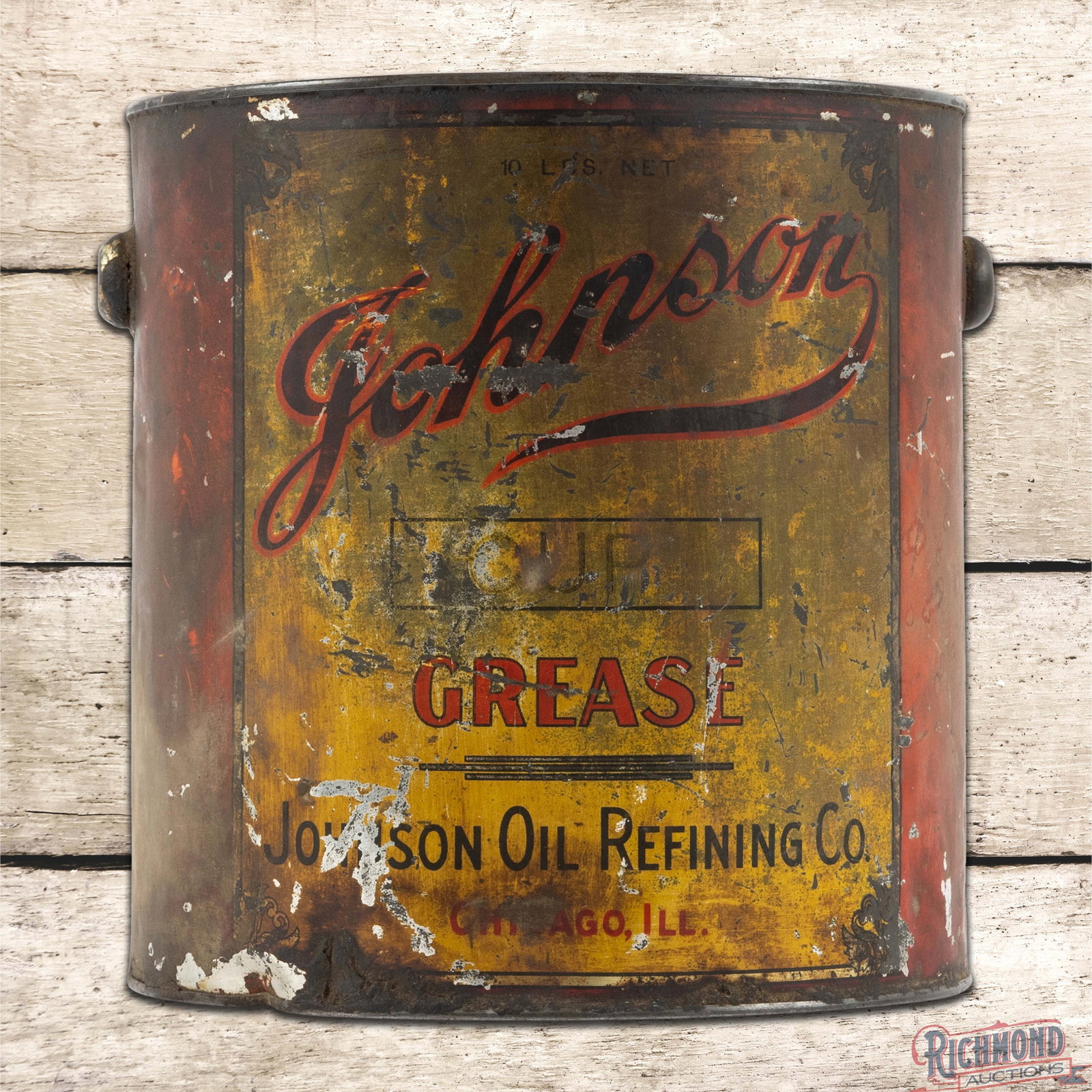 Early Johnson Oil Refining Co. 10 Pound Metal Grease Can Chicago Heights Illinois: Metal ten-pound grease can has moderate color and shine. The can has some product inside. The can presents with general wear, dents, paint loss and discoloration. The lid is present and the handle is 