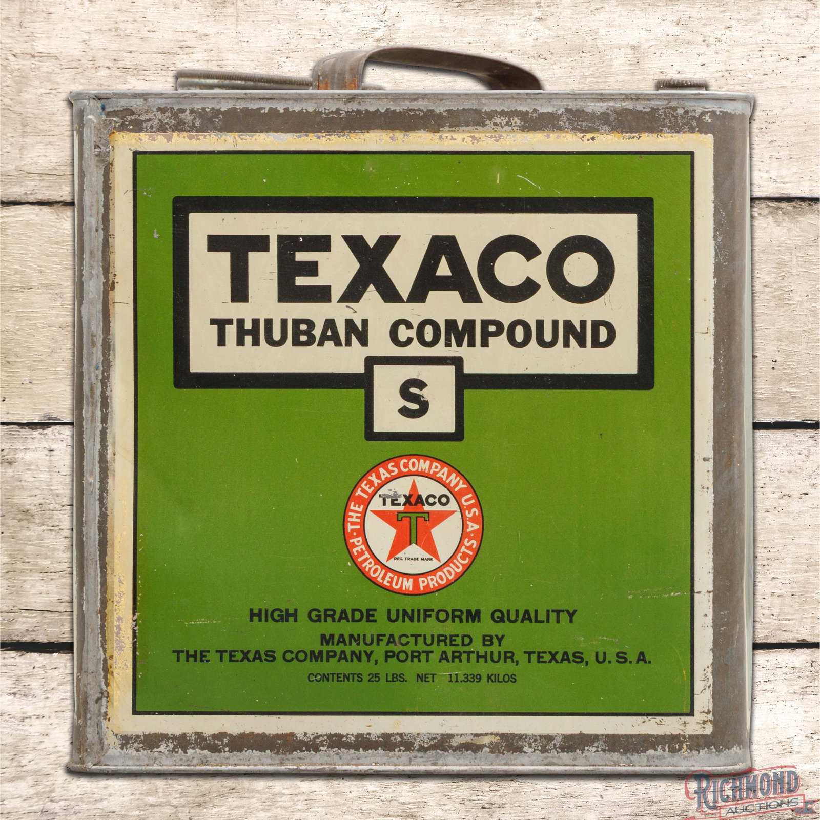 The Texas Company Texaco Empty Metal 25 Pound Thuban Compound Can w/ Logo: Empty metal 25 pound can has very good color and shine. Side #1 has light wear with light indentations in the field and edges. The reverse has heavier wear with a dent on the upper edge. The can retai