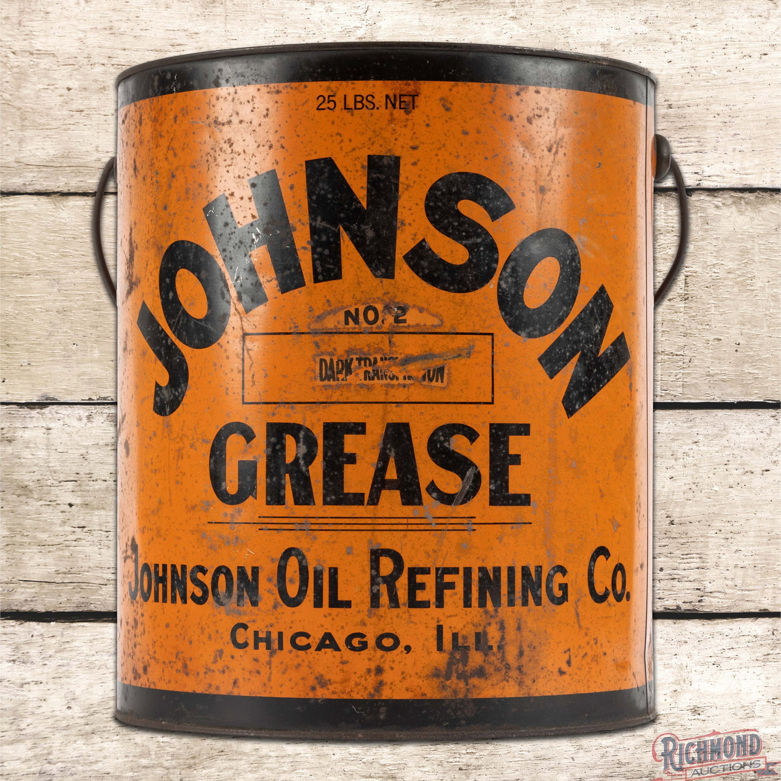 Johnson Oil Refining Co. 25 Pound Empty Metal Grease Can: Empty metal grease can has good color and shine. The handle is present and the lid is missing. The display with logo has surface wear with wash, scratches and oxidation. The reverse is in a similar co