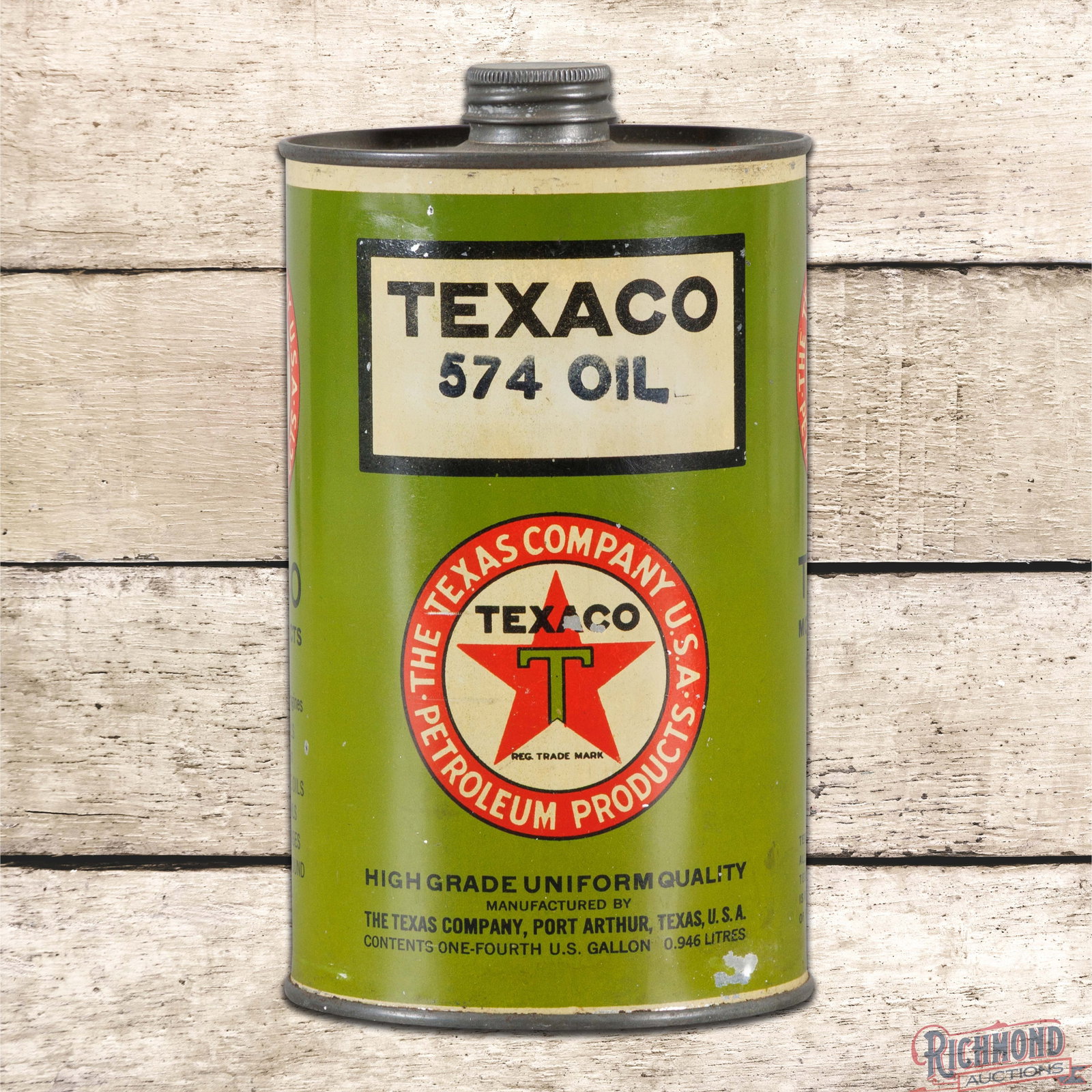 Texaco 574 Motor Oil Empty Metal Quart Can w/ Logo: Empty metal quart can with the original cap has very good color and shine. The display has paint chips with minor indentations in the field and a small dent on the lower right edge. The reverse has li
