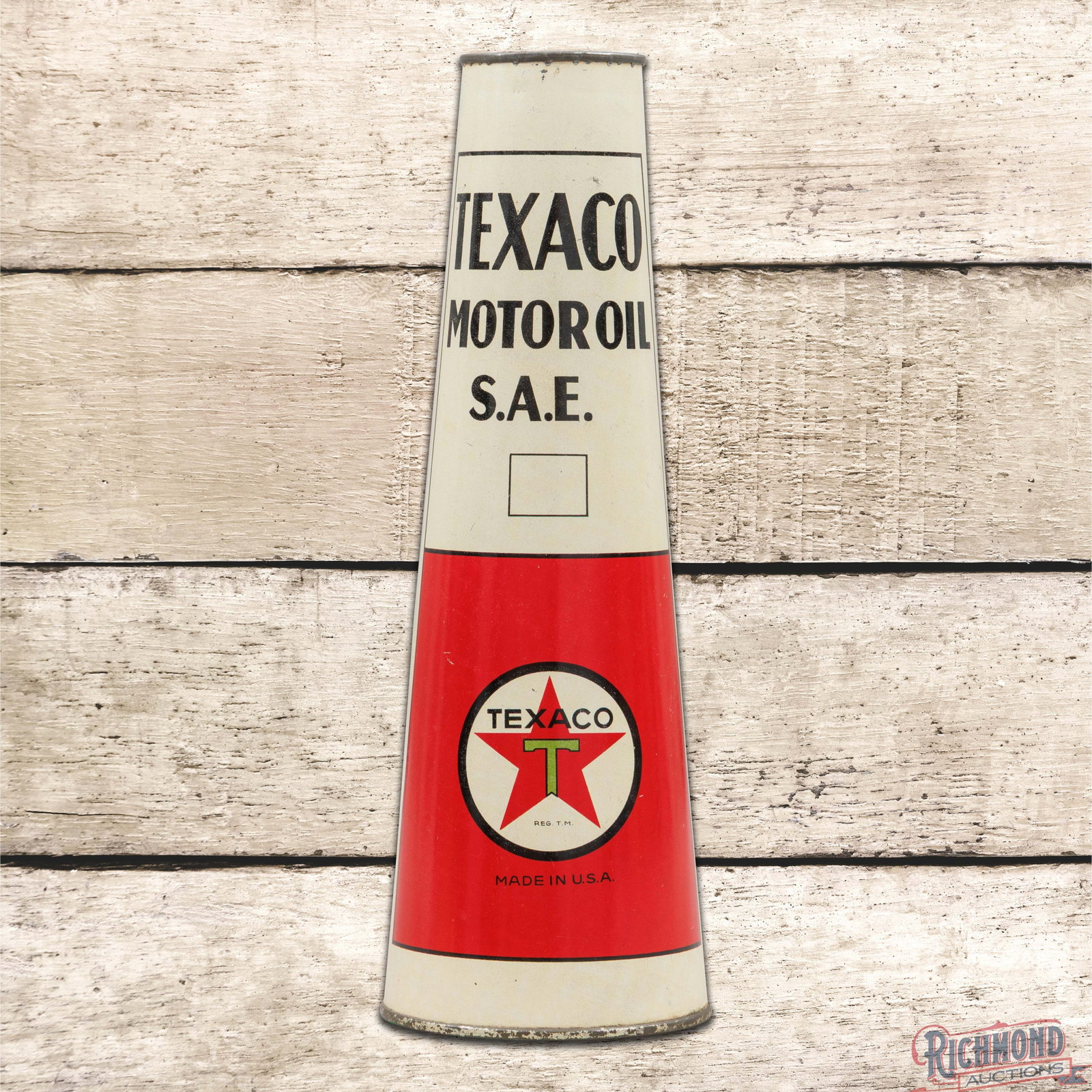 Texaco Motor Oil S.A.E. 1 Liter Empty Metal Cone Can: Empty metal cone shaped 1 liter can has excellent color and shine. The can retains both lids and has been emptied from the top. The display is clean with minor surface wear. The reverse is similar wit